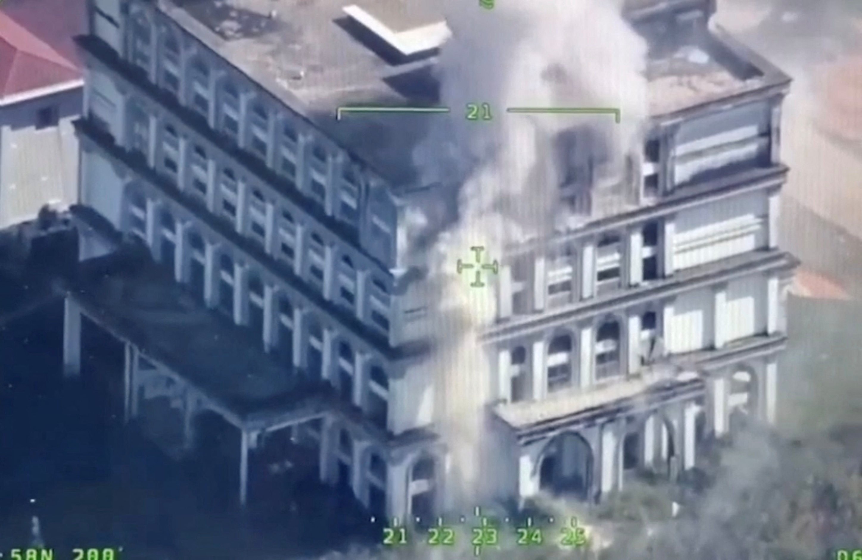 Smoke rises from a building following an explosion near the Trat and Thmar Dar border between Thailand and Cambodia on December 10. Photo: Royal Thai Navy via Reuters