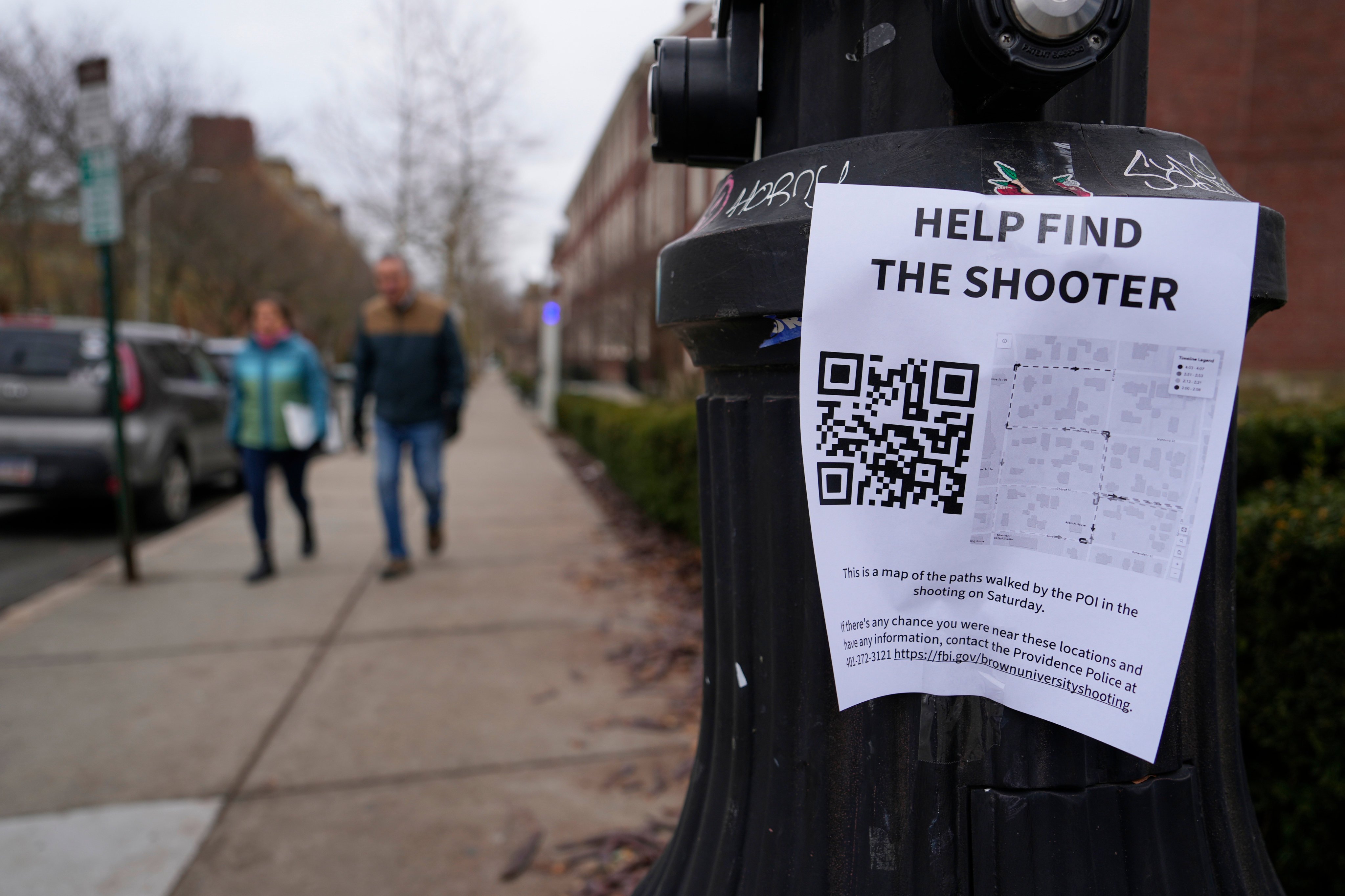 A poster seeking information about the shooting suspect is seen on the campus of Brown University on Wednesday. Photo: AP