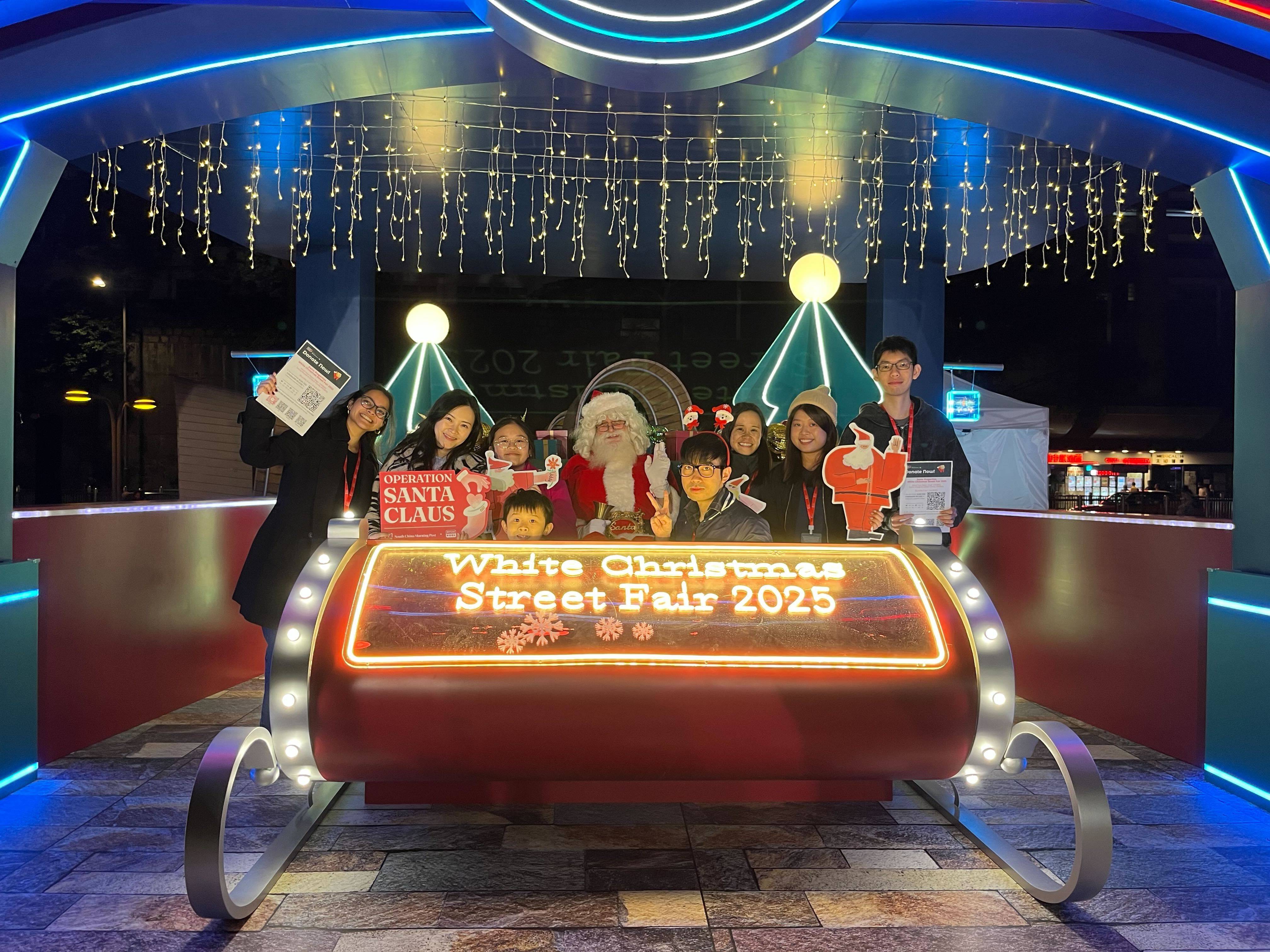 OSC volunteers at Santa’s Neon Studio. Photo: Handout