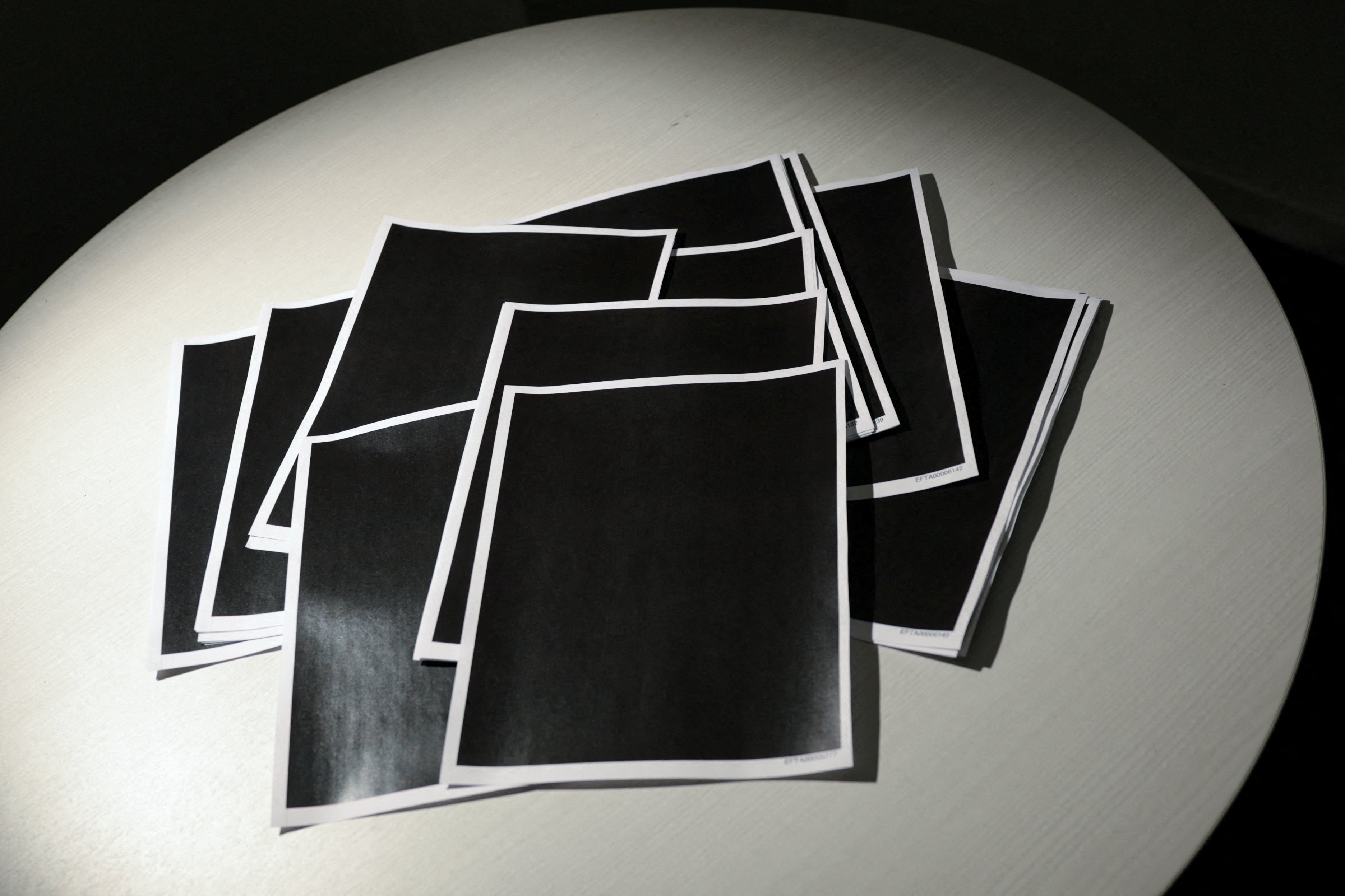 Newly-released documents from disgraced late financier and sex offender Jeffrey Epstein, including a sheaf of entirely redacted pages. Photo: Reuters