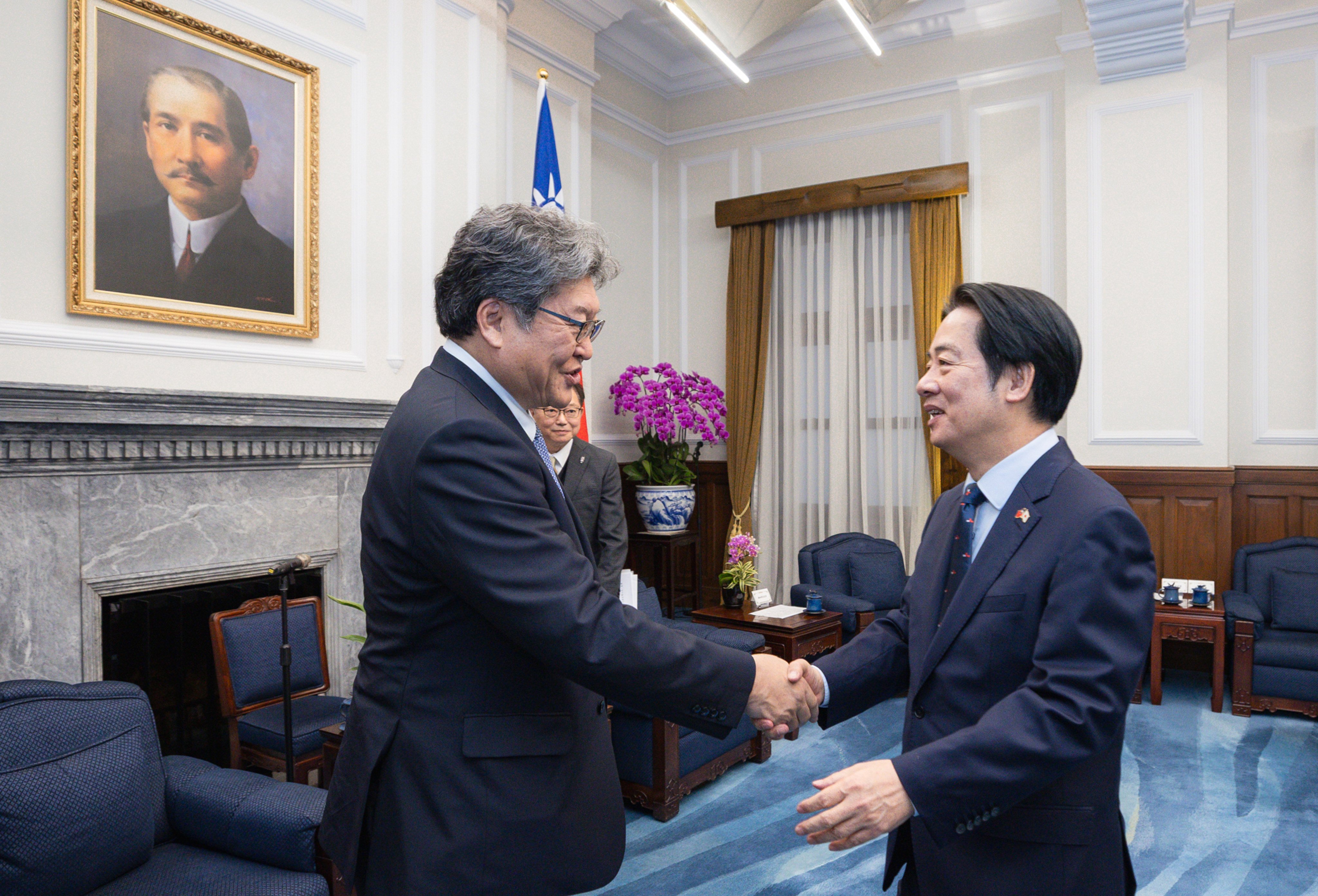 Japanese lawmaker Koichi Hagiuda (left) meets Taiwanese leader William Lai in Taipei on Monday. Photo: Handout
