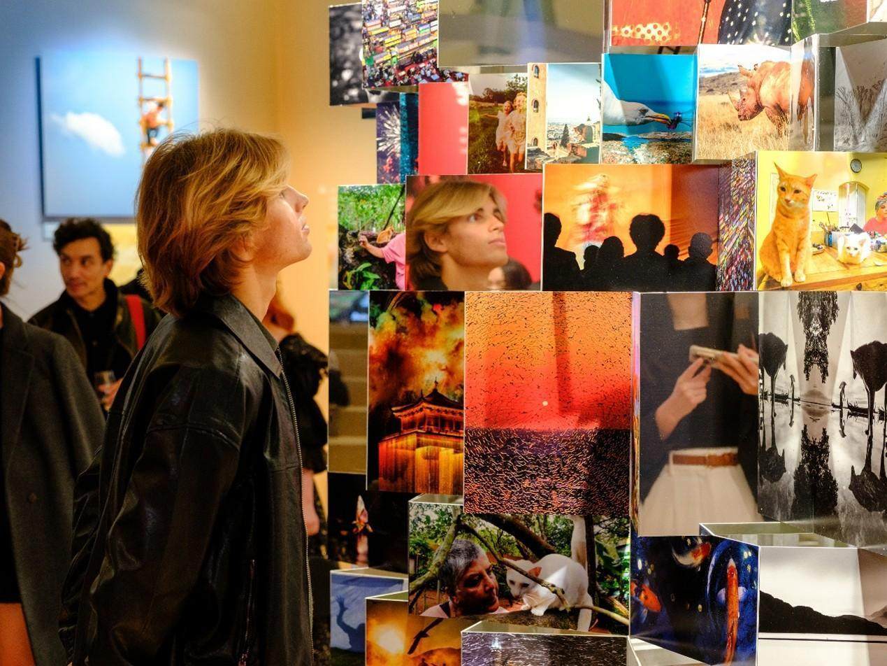 A visitor admires the images shortlisted in this year’s competition at last month’s Huawei Xmage Awards 2025 Ceremony and Exhibition, based on the theme “The World, You and Me”, in Paris.