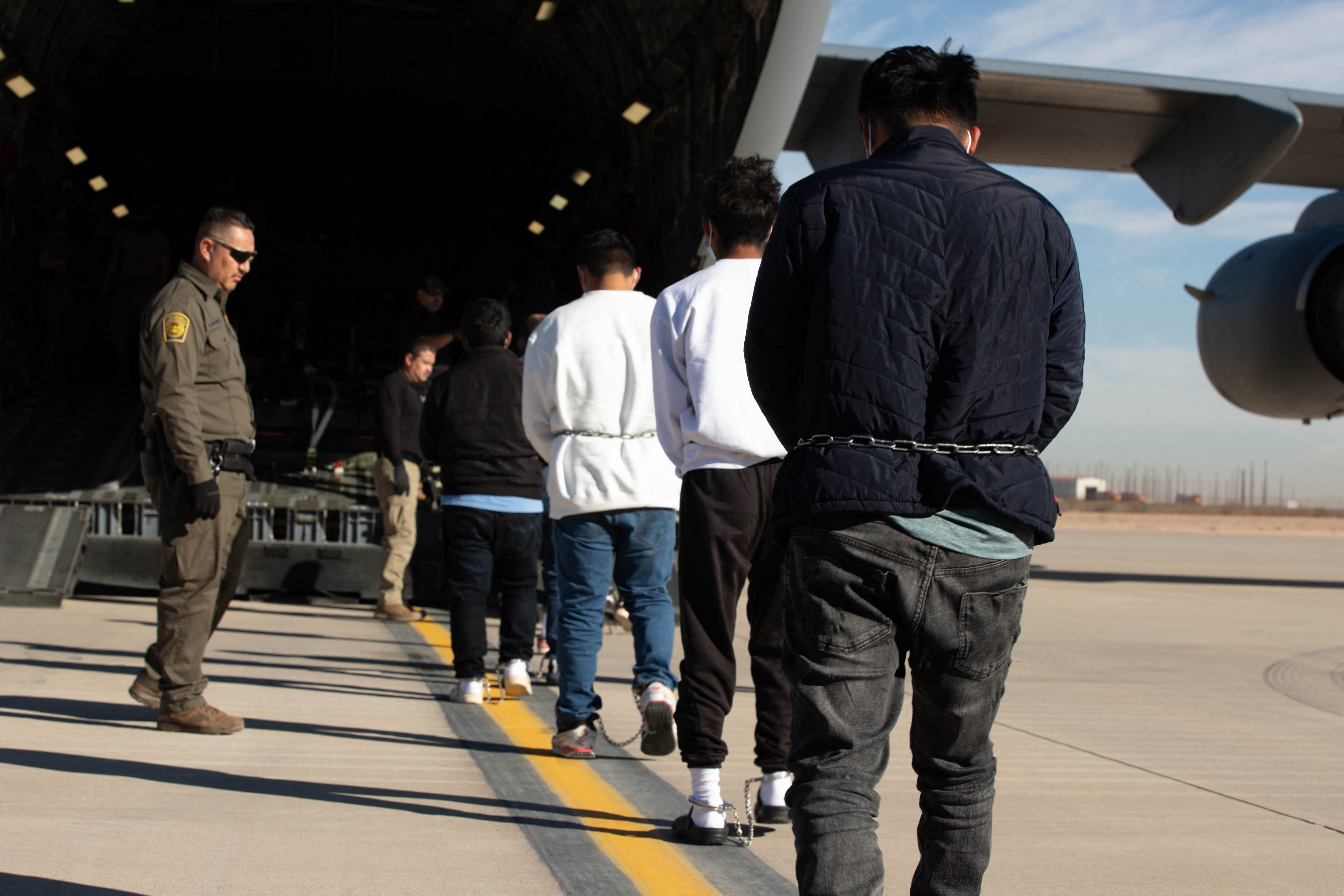 US officials oversee a deportation flight at Fort Bliss, Texas in February. Photo: Department of Defence/AFP