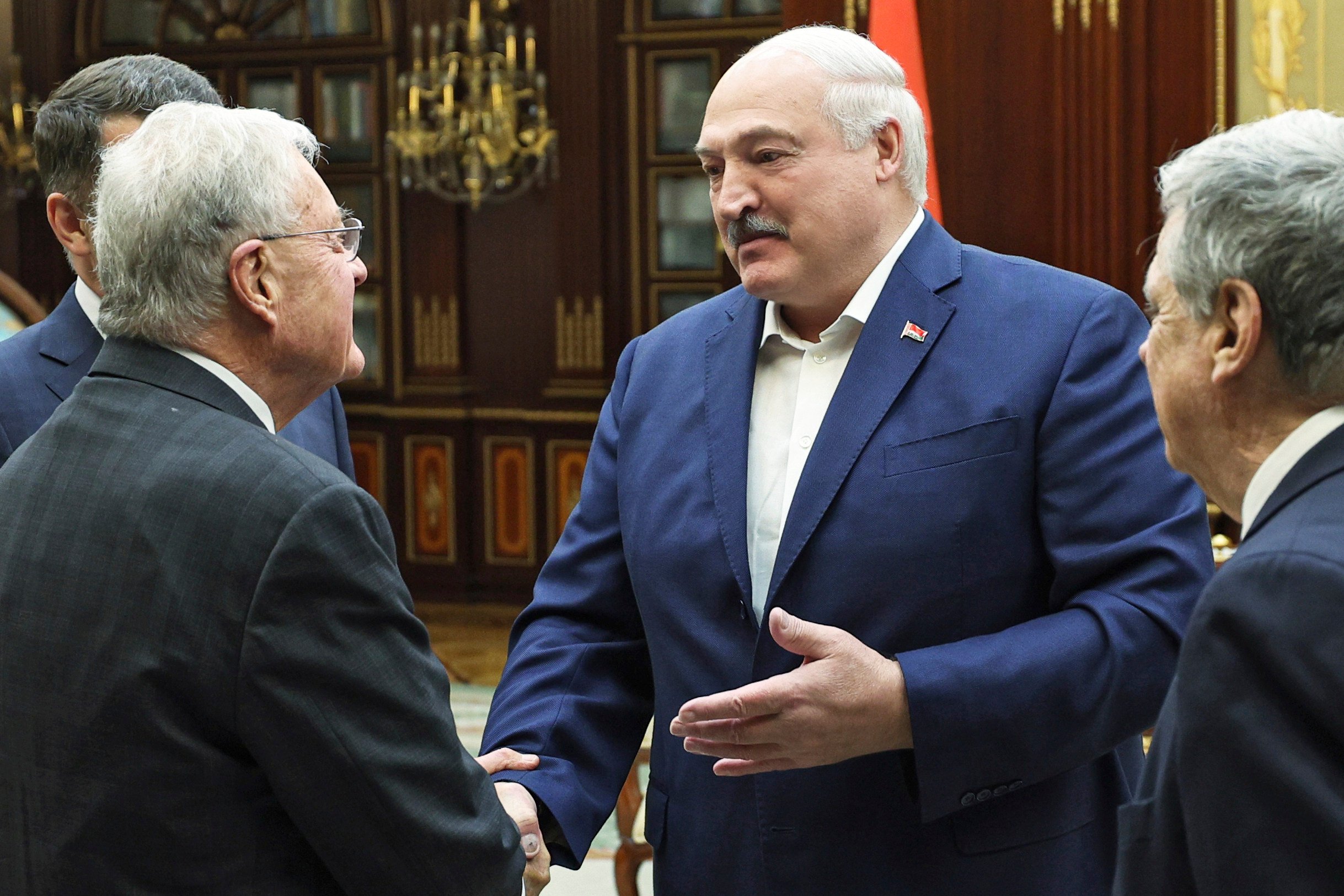 In this photo released by the Belarusian Presidential Press Service, Belarusian President Alexander Lukashenko (second right) greets Keith Kellogg, the US Special Envoy for Ukraine and Russia (left) before their meeting in Minsk, Belarus, on June 21. Photo: Handout via AP