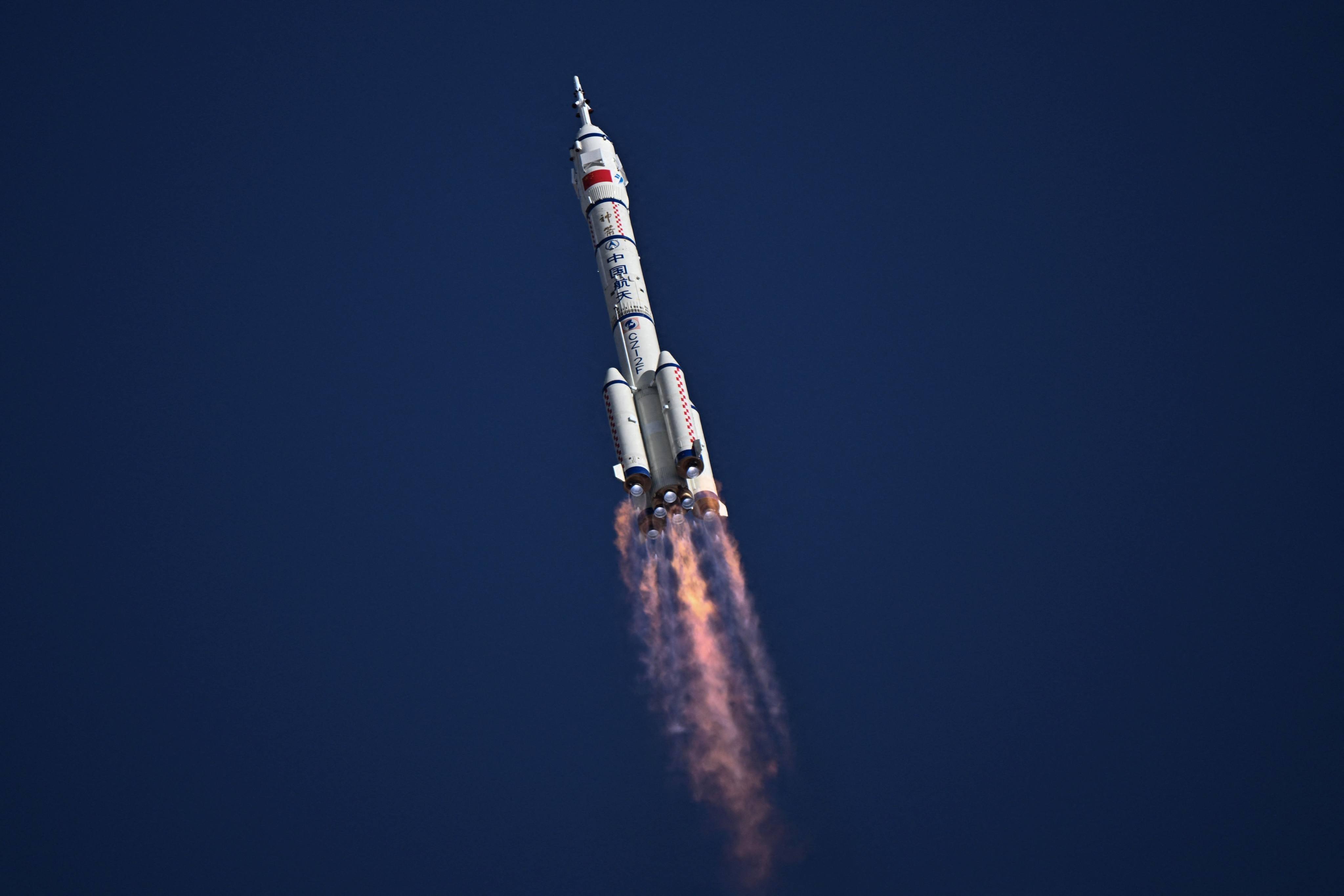 A Long March-2F carrier rocket, carrying the Shenzhou-20 spacecraft and a crew of three astronauts, lifts off from the Jiuquan Satellite Launch Centre in the Gobi desert, in northwest China on April 24. Photo: AFP