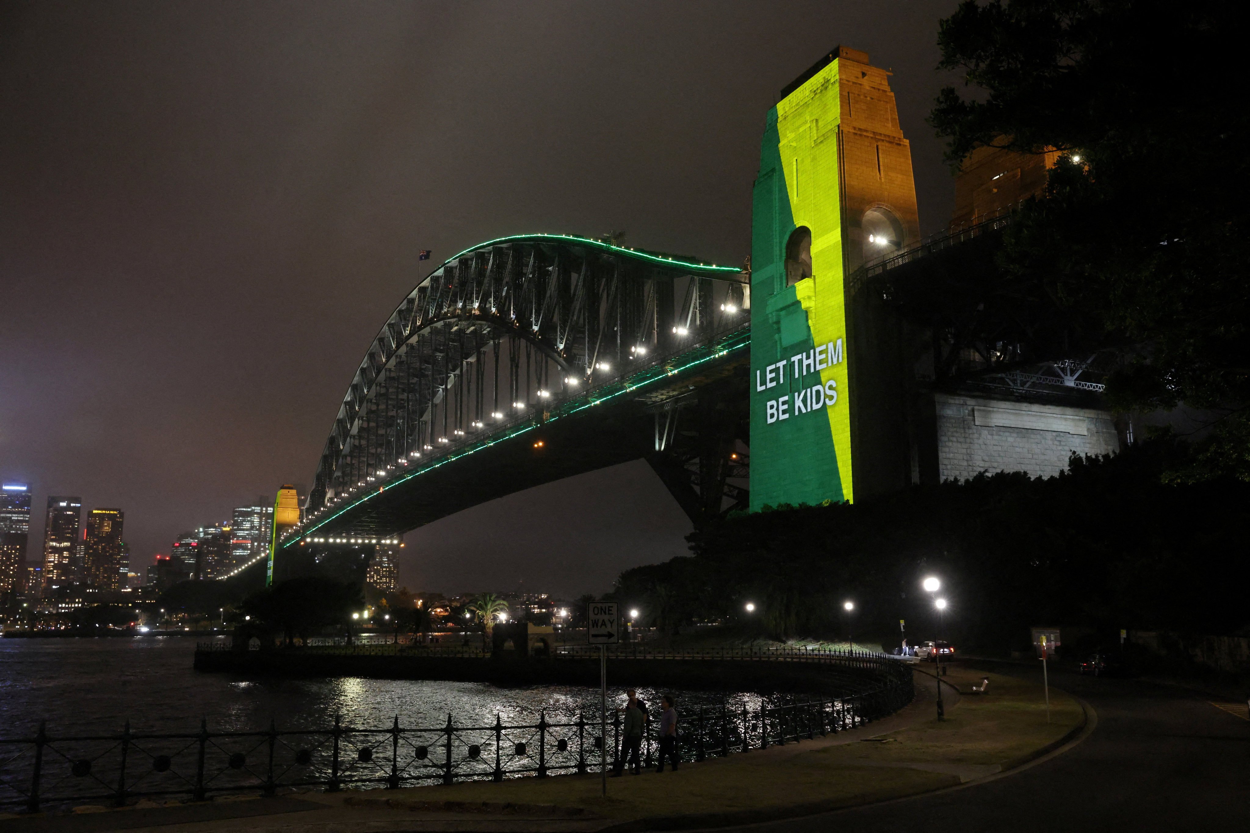 A message that reads “Let them be kids” is projected onto the Sydney Harbour Bridge to mark a law banning social media for users under 16 in Australia on December 10. Photo: Reuters
