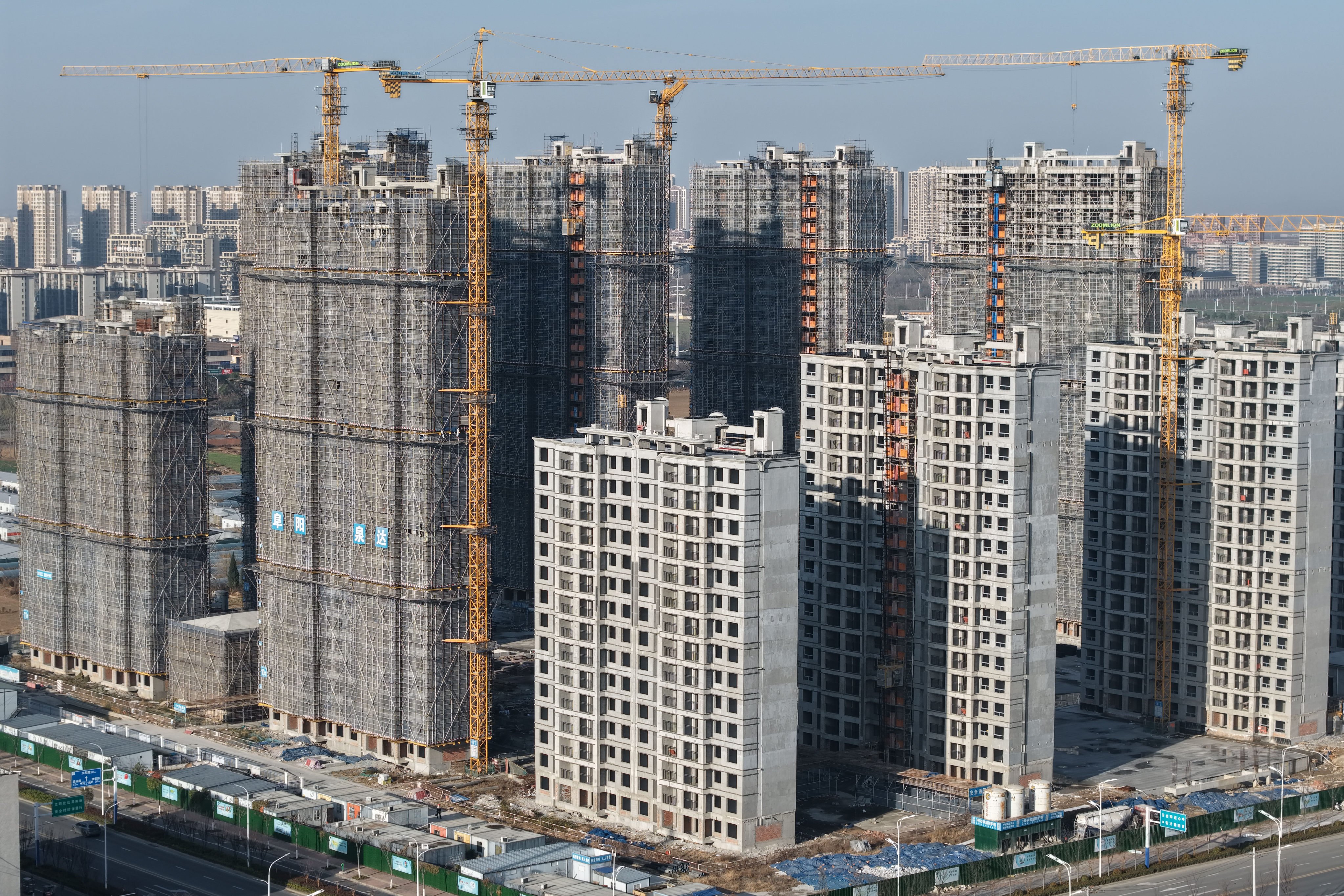 Residential buildings are seen under construction in Fuyang, Anhui province, on December 15. Photo: Getty Images