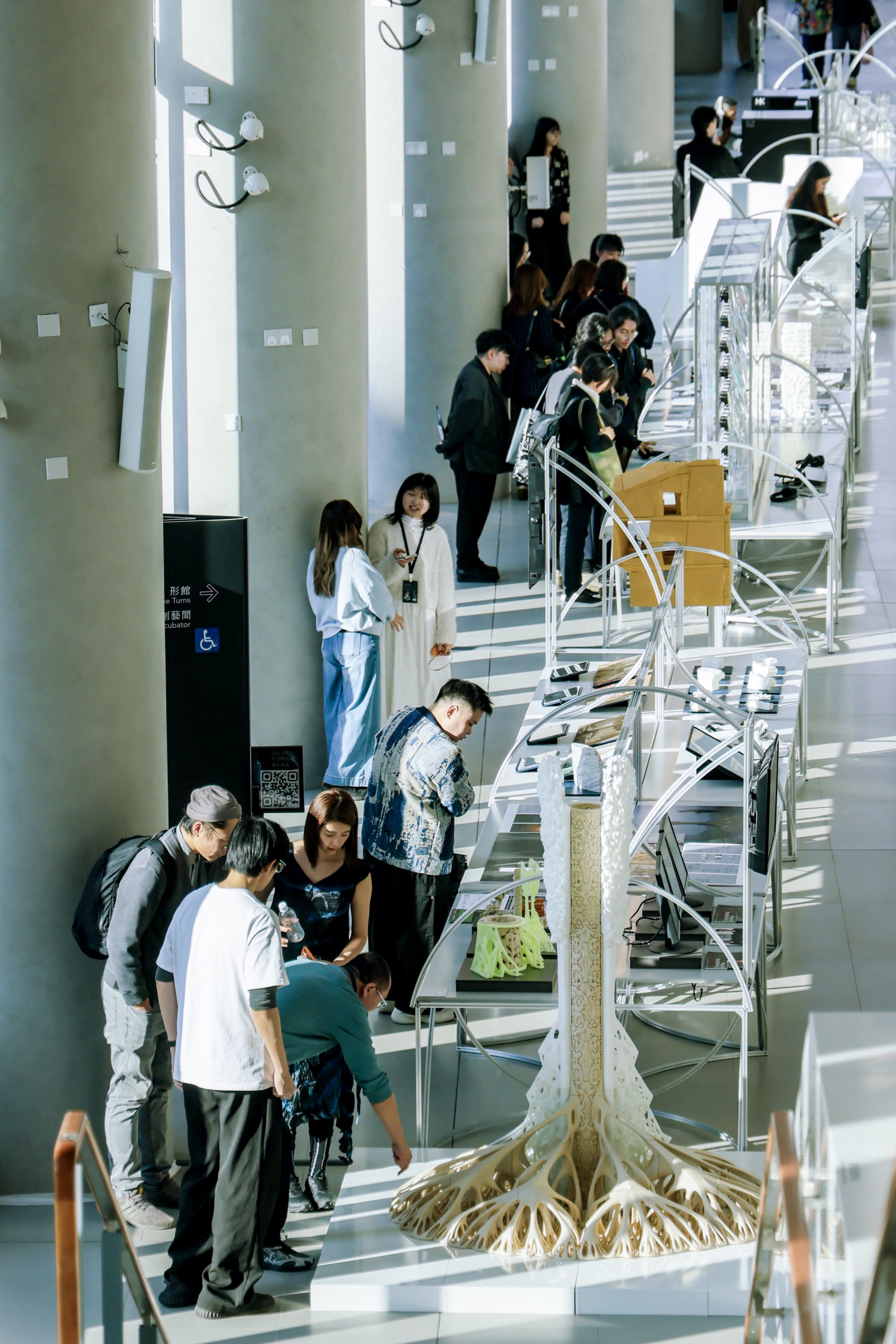 Visitors view a display at the 2025 Hong Kong Shenzhen Bi-City Biennale of Urbanism\Architecture exhibition at the East Kowloon Cultural Centre. Photo: eKCC