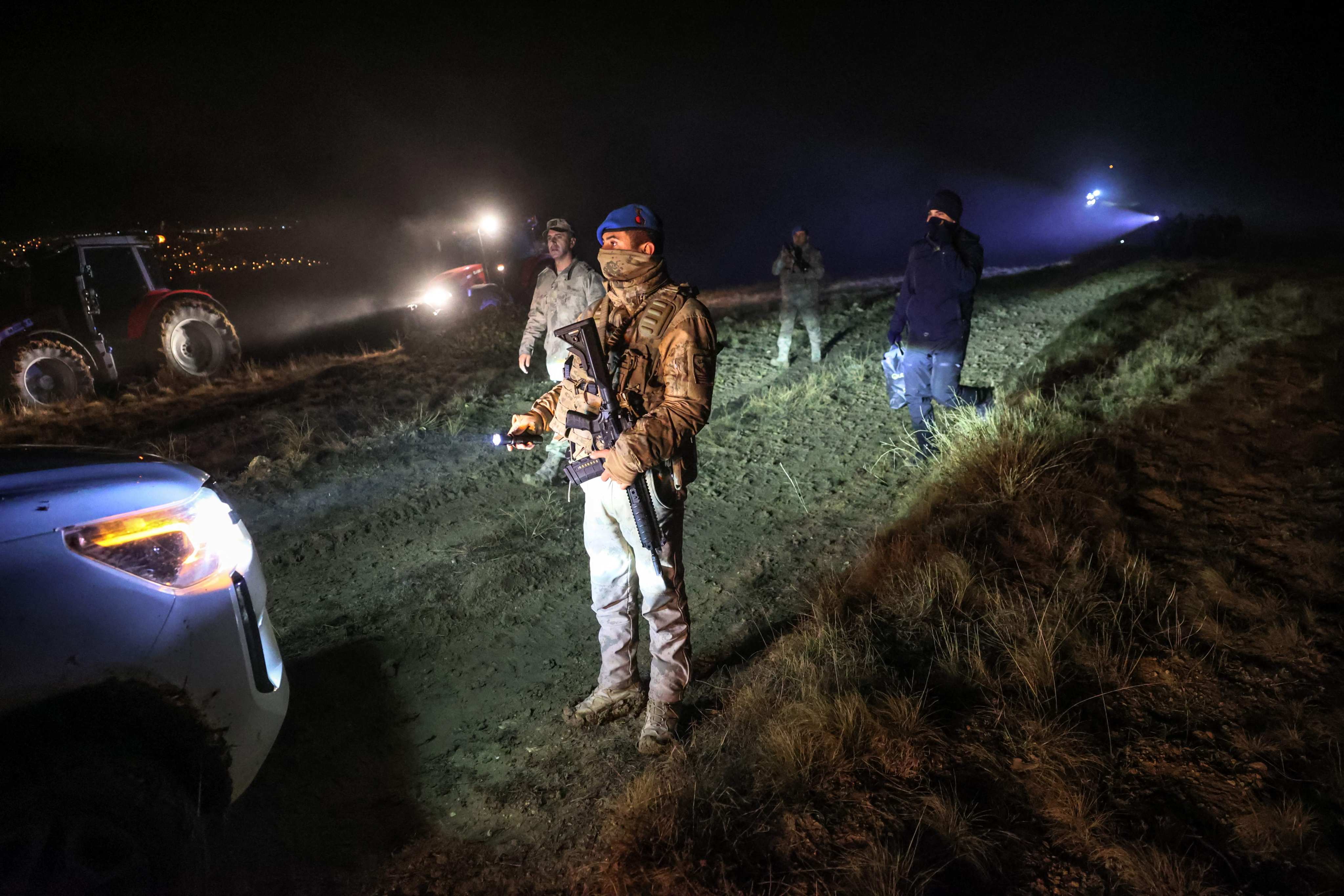 Turkish soldiers stand guard near the wreckage a Libya-bound business jet near Ankara as search and rescue operations continue on Tuesday. Photo: AFP