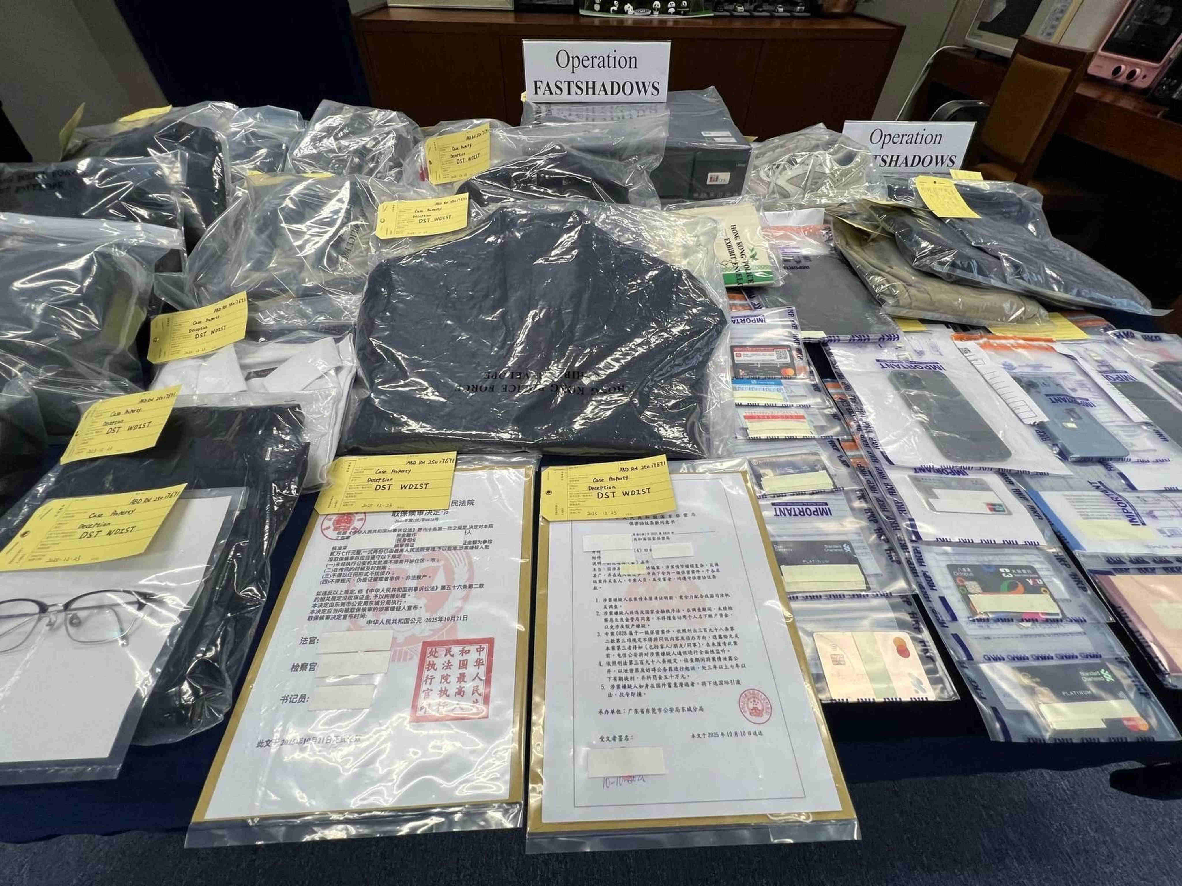 Some of the evidence seized as Hong Kong police arrested 20 people over a series of fraud cases in which victims were scammed out of more than HK$2 million. Photo: Handout