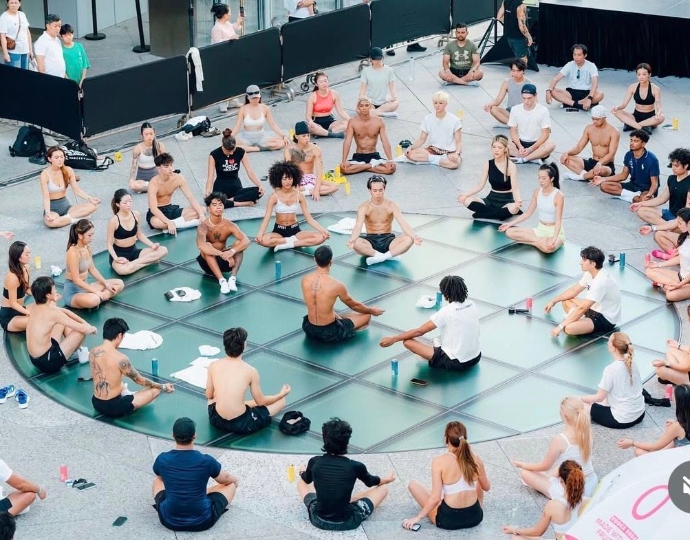 People take part in a yoga session at a recent SoberSweat event. Hong Kong’s young professionals are ditching traditional networking for wellness social clubs like this one. Photo: SoberSweat