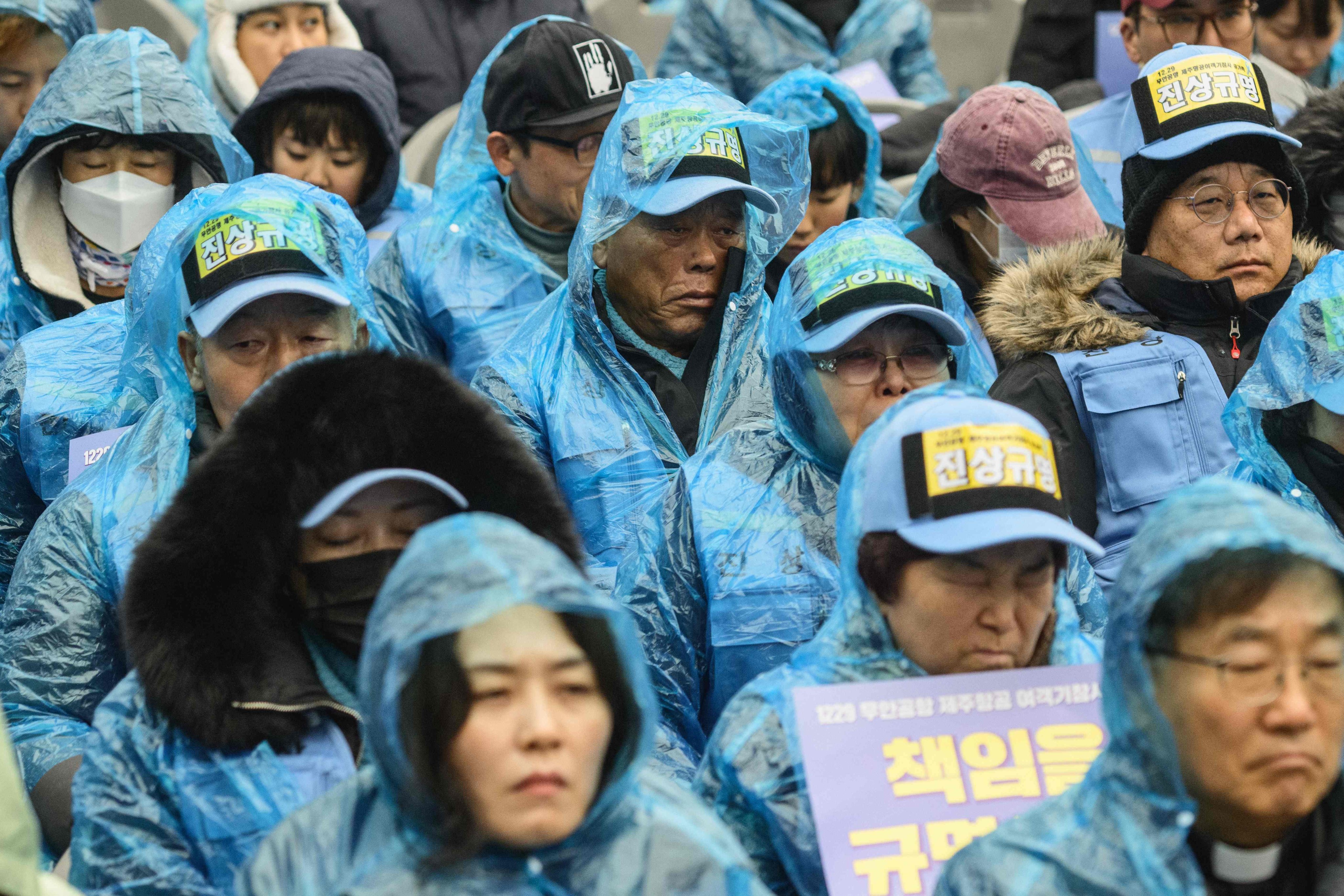 Family members of the victims of last year’s Jeju Air plane crash at South Korea’s Muan International Airport attend a rally in Seoul on December 20. Photo: AFP
