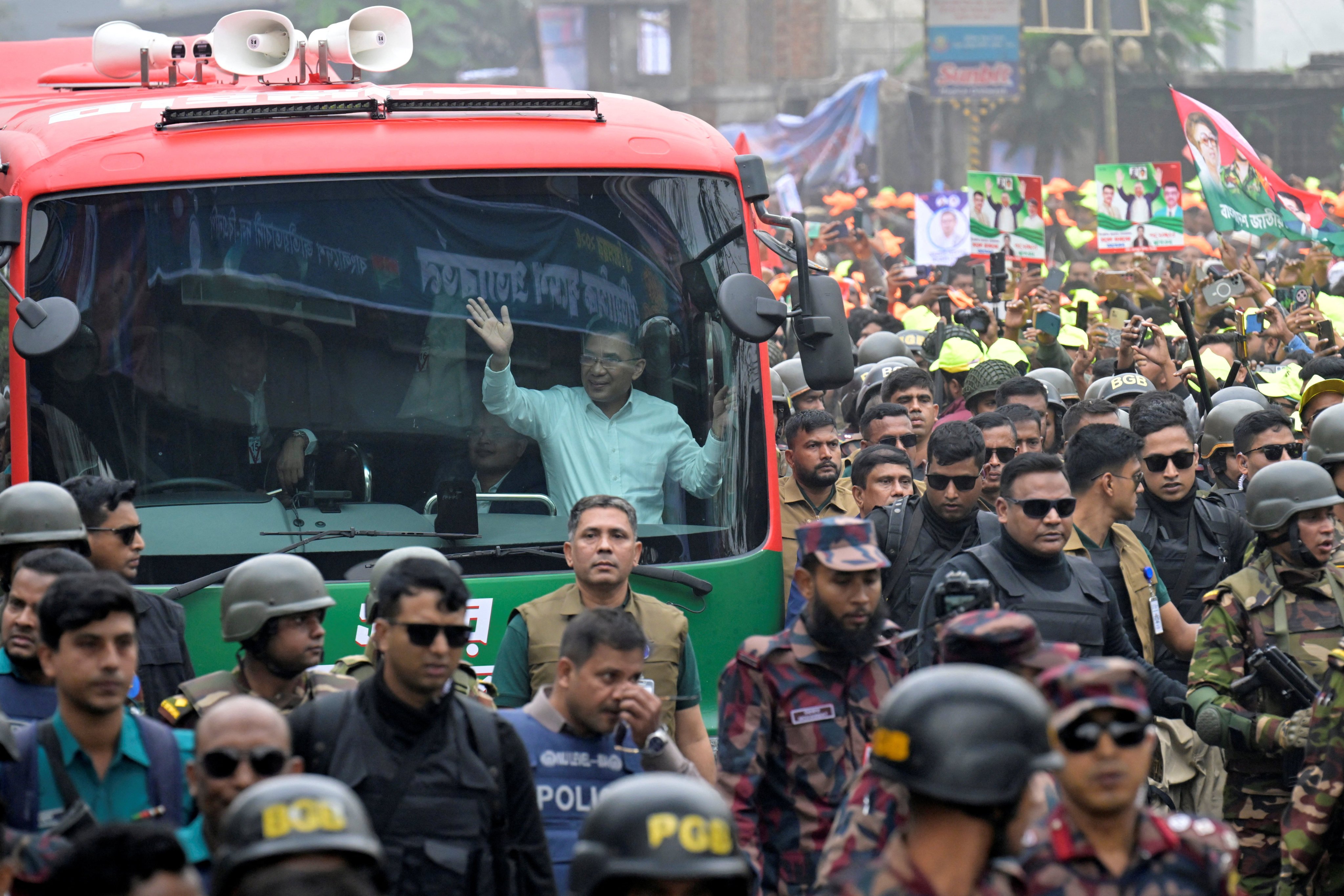 Bangladesh Nationalist Party (BNP) acting chairman Tarique Rahman waves to crowds from a vehicle after his arrival in Dhaka, Bangladesh, on Thursday. Photo: Reuters