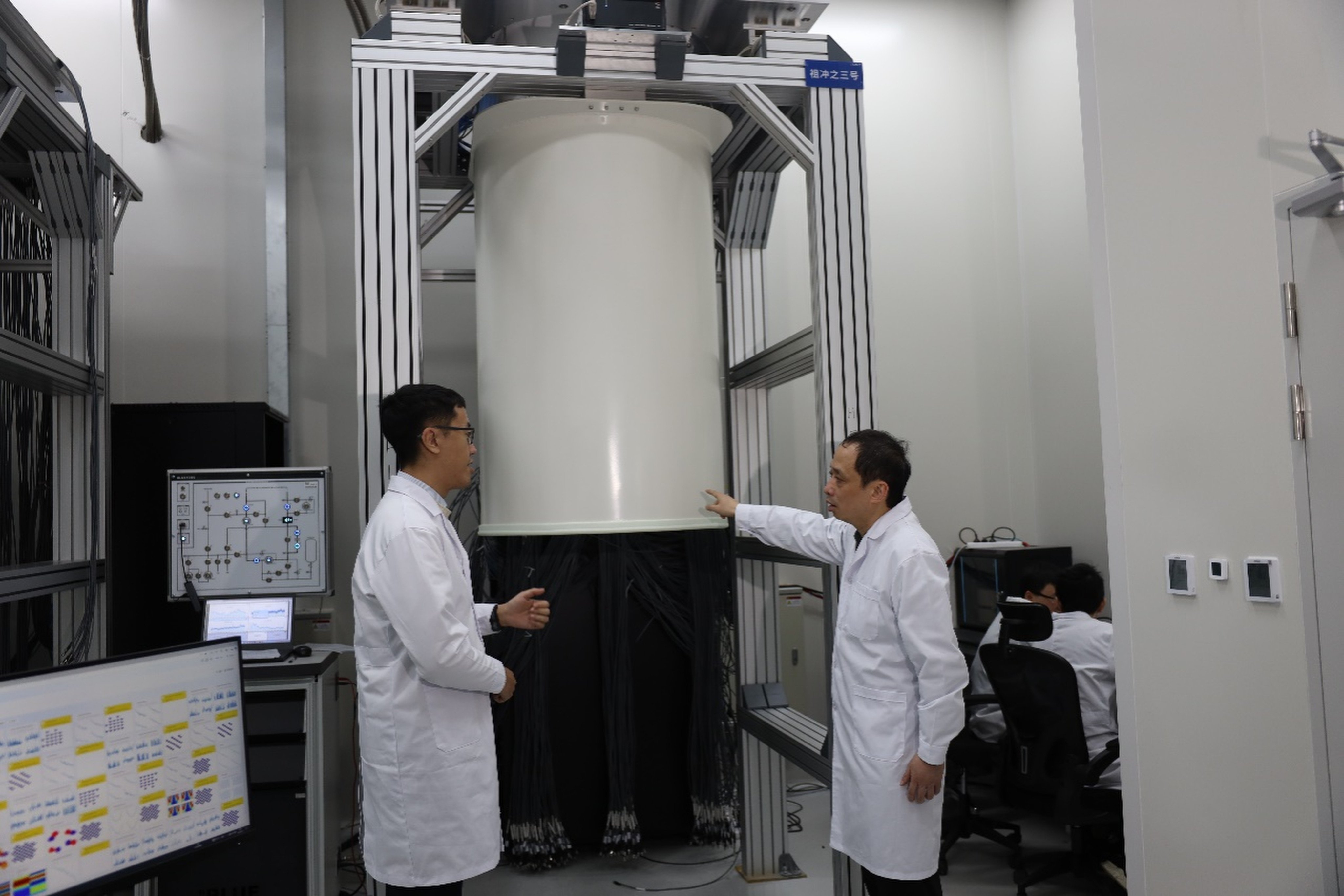 Researchers at the University of Science and Technology of China, in the central province of Anhui, stand in front of the Zuchongzhi 3.2 superconducting quantum computing system. Photo:  Handout