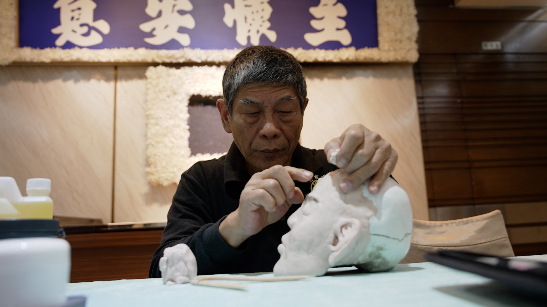 Taiwanese mortuary reconstruction specialist Kuo Chang-chen demonstrates the steps of body restoration