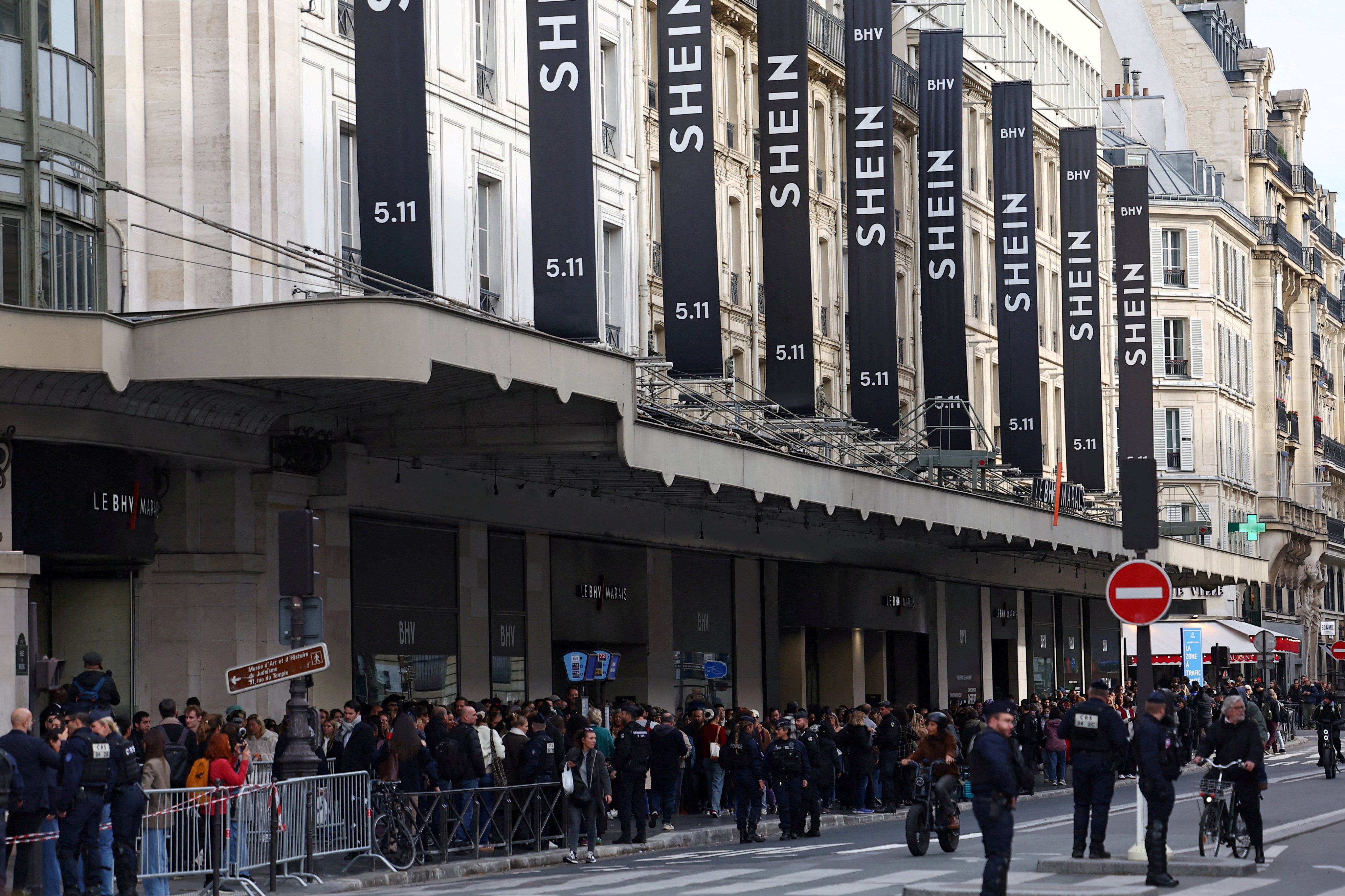 Shoppers queue for the opening of the first physical space for Chinese online fast-fashion retailer Shein in Paris. Photo: Reuters