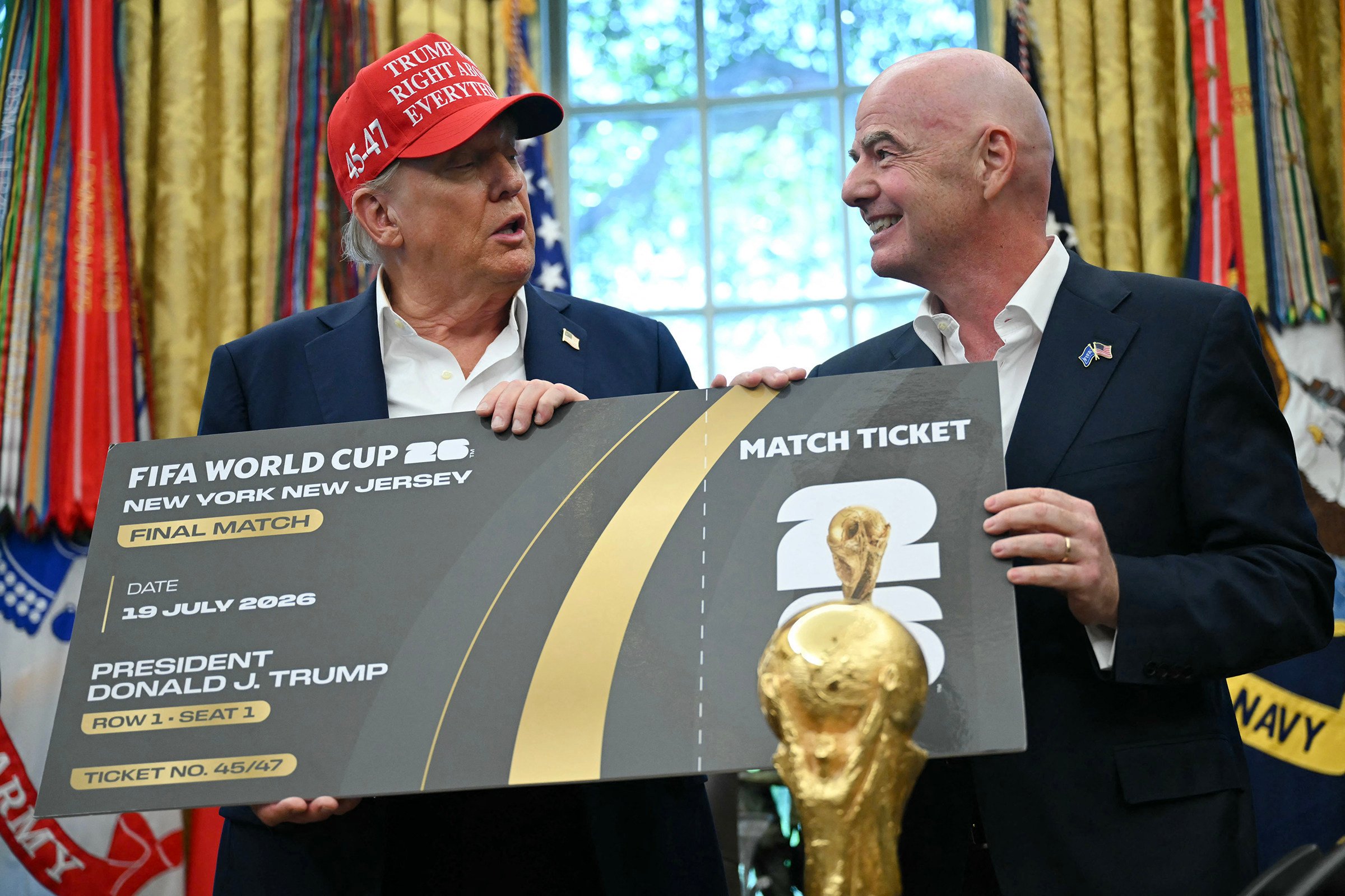 Fifa president Gianni Infantino, right, presents US President Donald Trump with a World Cup ticket for the final match, in the Oval Office of the White House in Washington on August 22. Photo: AFP