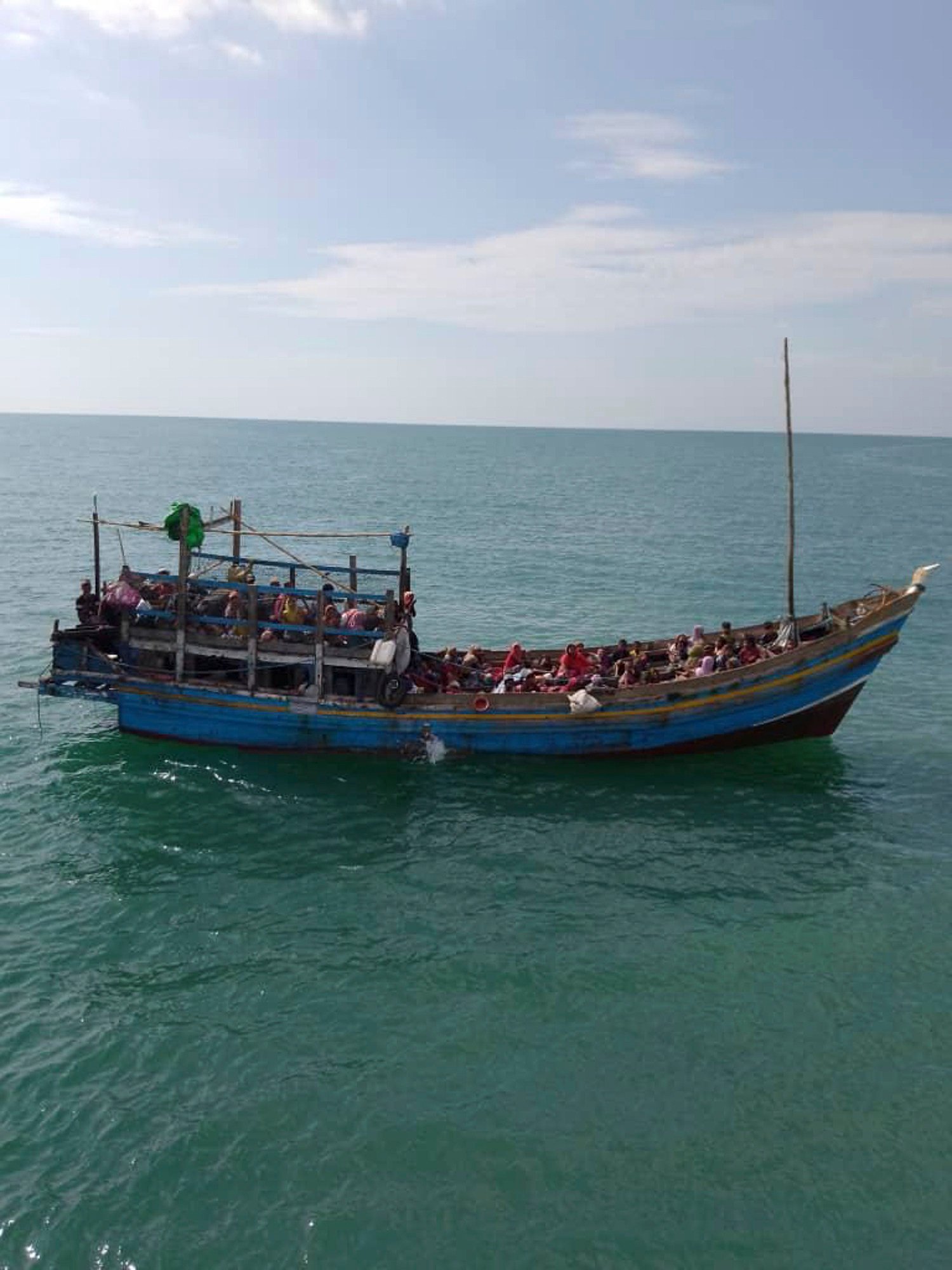 A boat with Rohingya refugees attempts to enter Malaysia from Langkawi in this photo released on January 4. Photo: Malaysian Maritime Enforcement Agency/AP