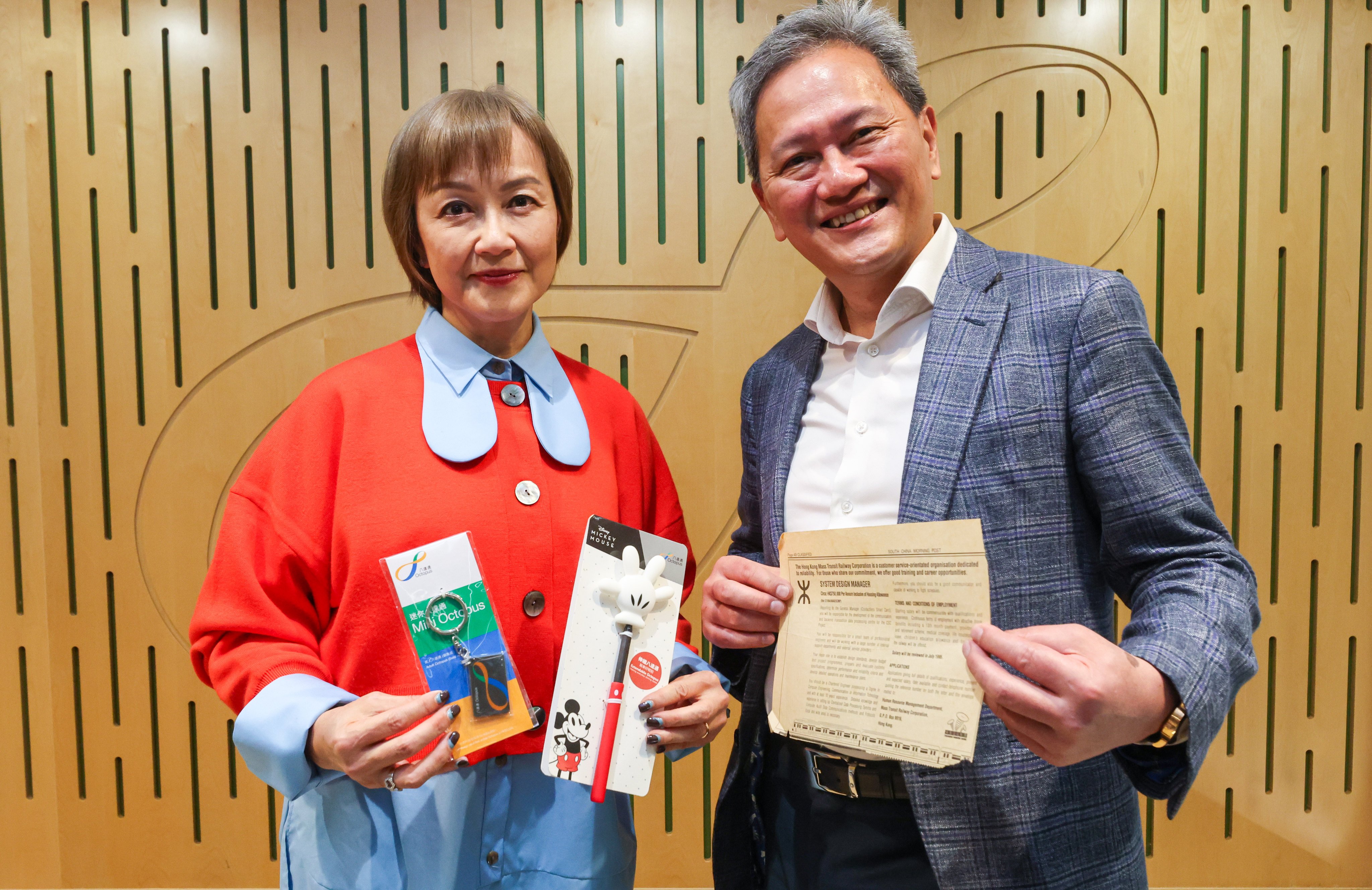 Octopus’ sales and marketing director Rita Li and chief operations officer Sammy Kam hold up items of memorabilia at their office in Kowloon Bay. Photo: Edmond So