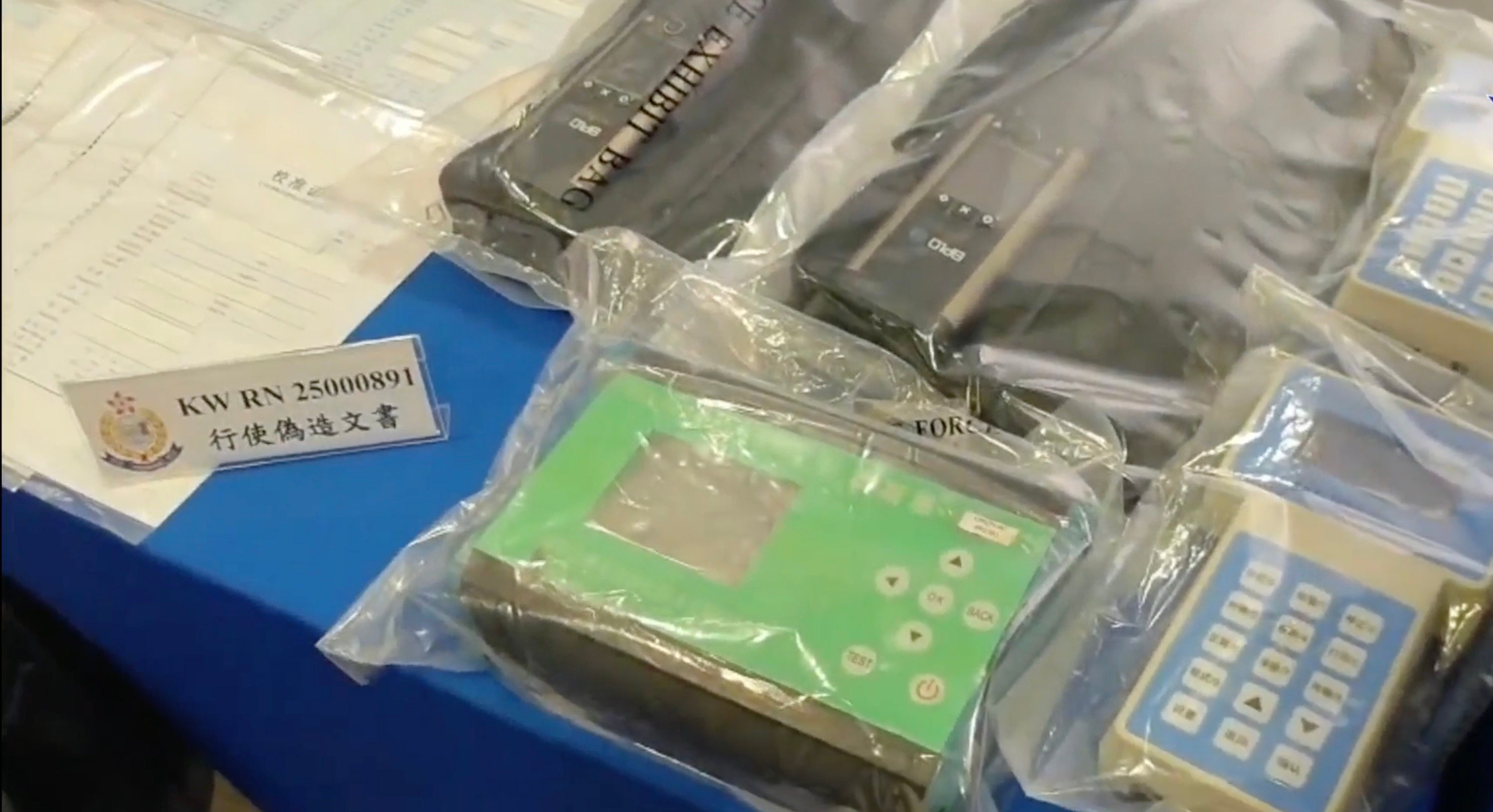 Hong Kong police have arrested nine employees of a company suspected of using surveying equipment with 45 forged certificates. Photo: Handout