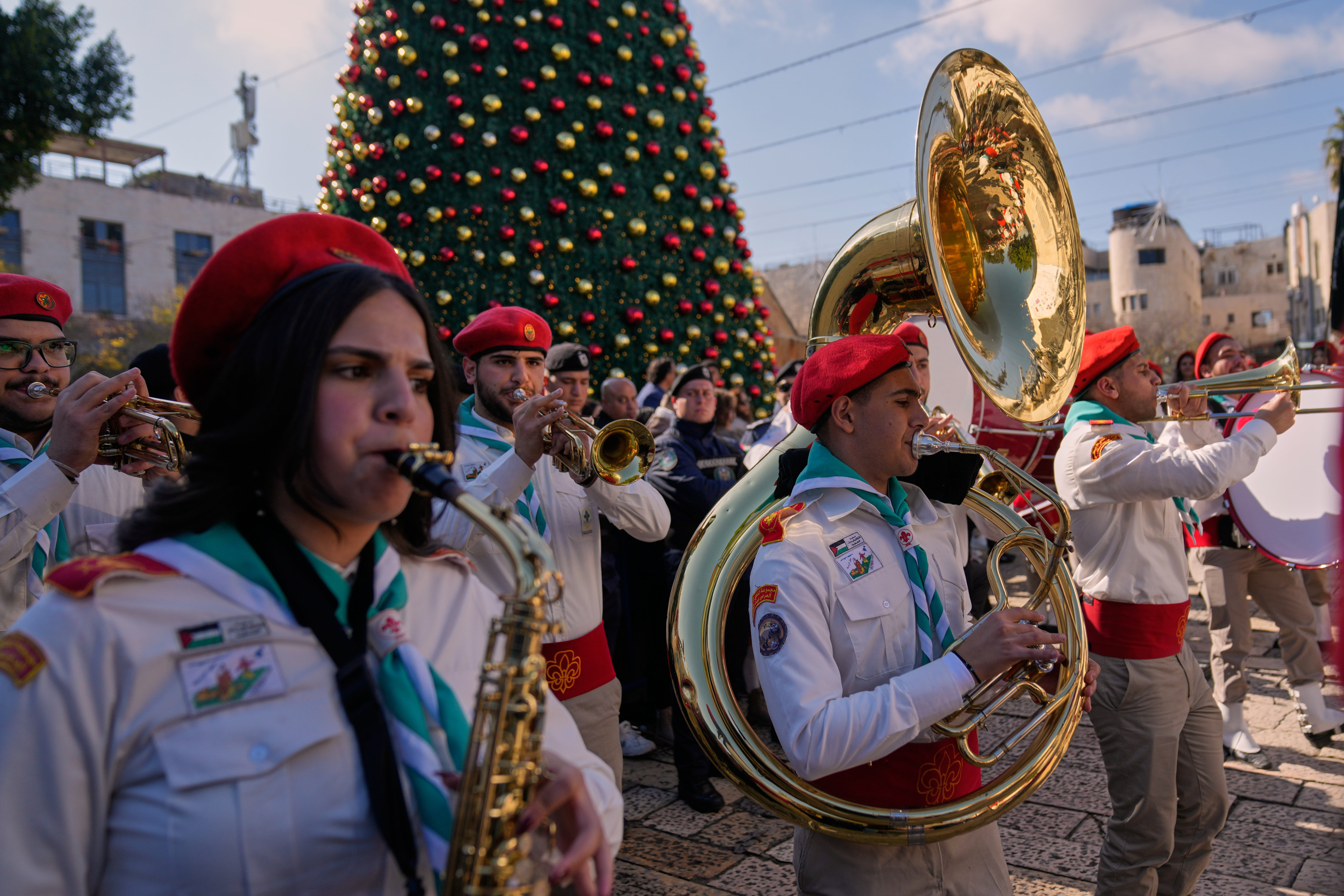 Palestinian scout bands parade at Manger Square near the Church of the Nativity, traditionally believed to be the birthplace of Jesus, on Christmas Eve in the West Bank city of Bethlehem. Photo: AP