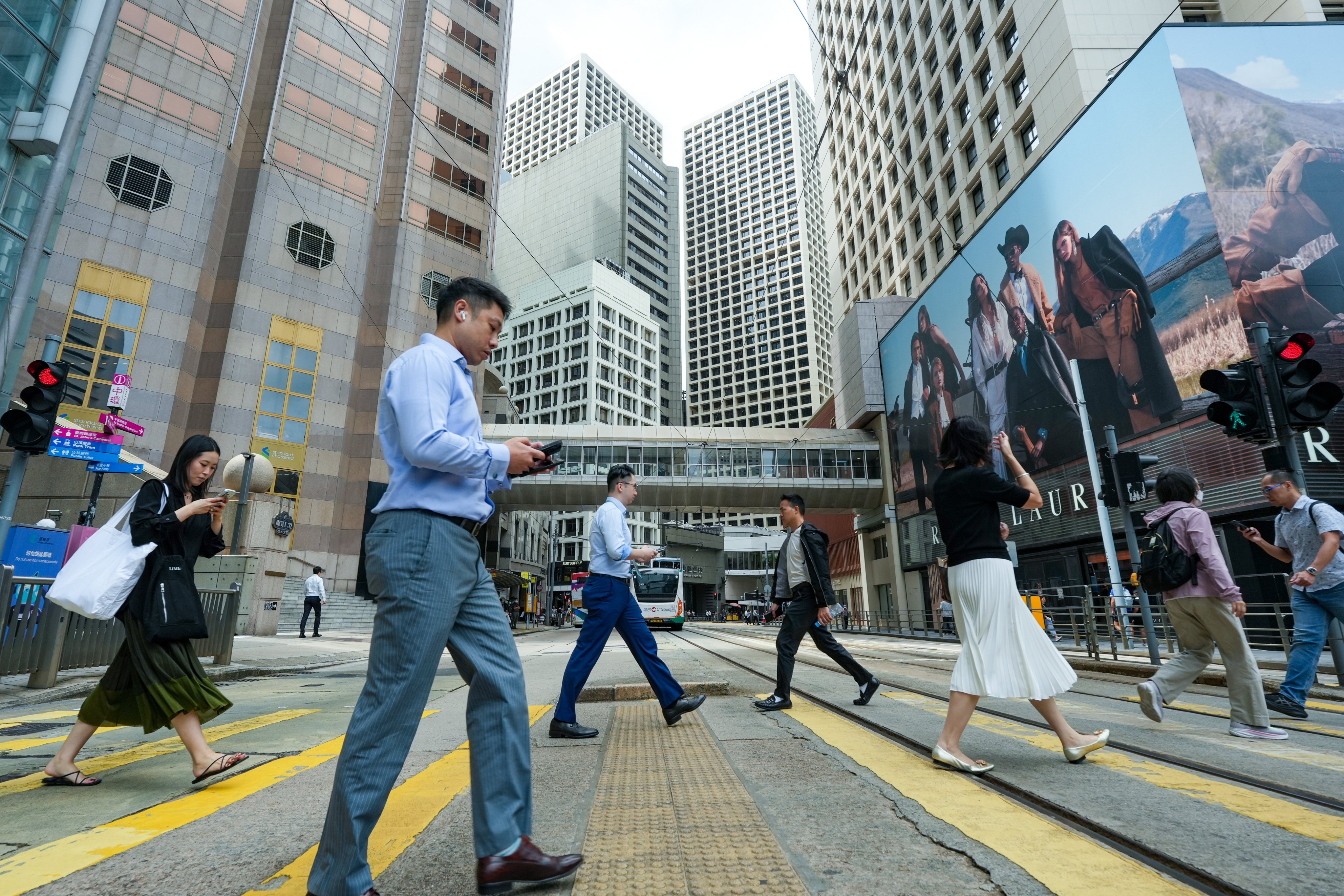 Commuters cross the street in Hong Kong’s Central district on October 20. Photo: Sun Yeung