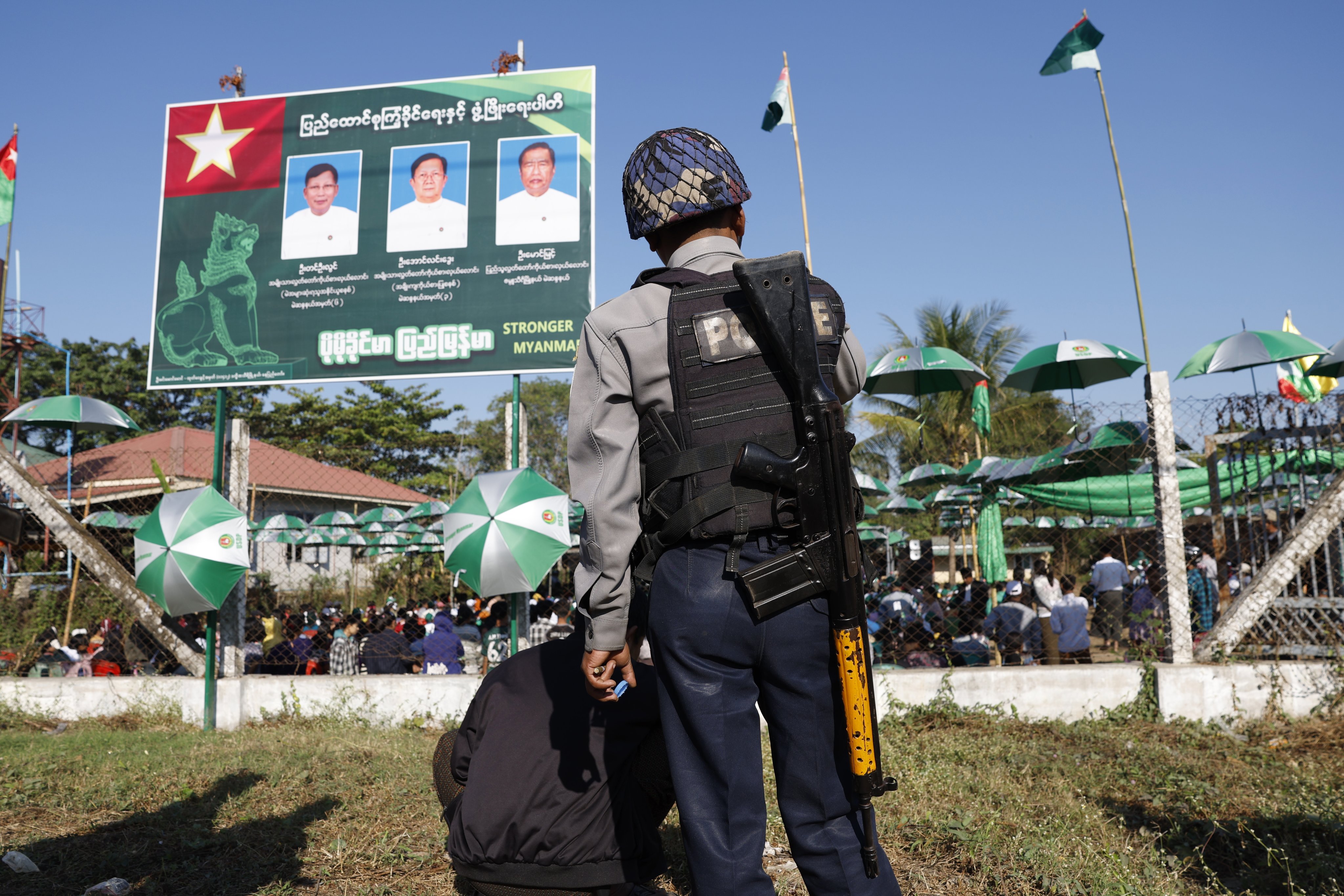 A Myanmar police officer stands guard during the Union Solidarity and Development Party’s election campaign on the final day of campaigning in Naypyitaw on Friday. Photo: EPA