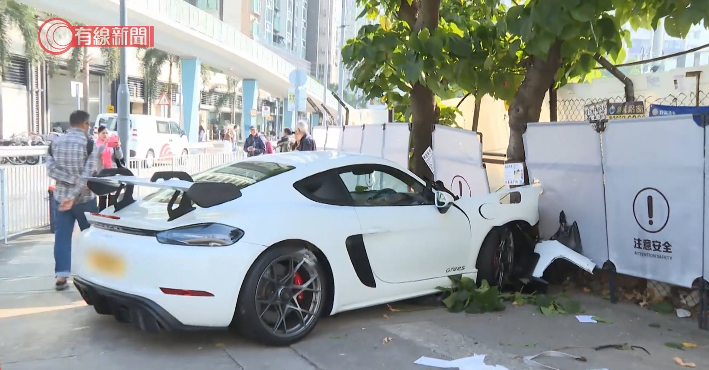 The driver of the white Porsche lost control and crashed through a barricade. Photo: Handout