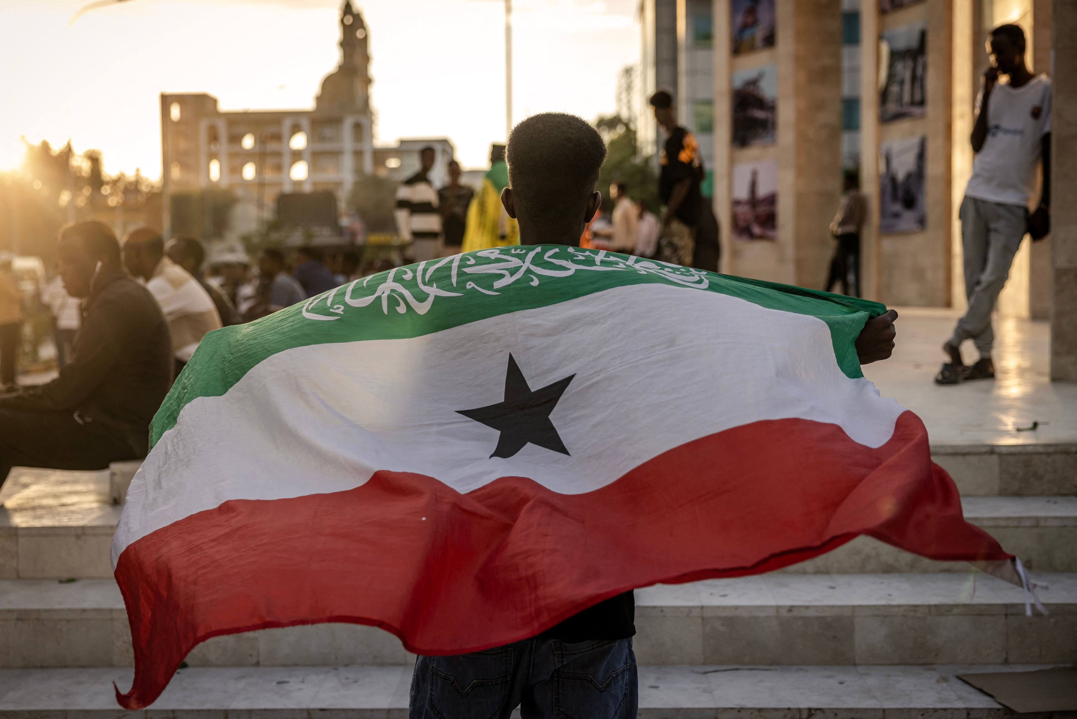 A man holds a flag of Somaliland in front of the Hargeisa War Memorial monument in Hargeisa. Somaliland’s president on Friday welcomed Israel’s announcement that it was recognising its statehood. Photo: AFP