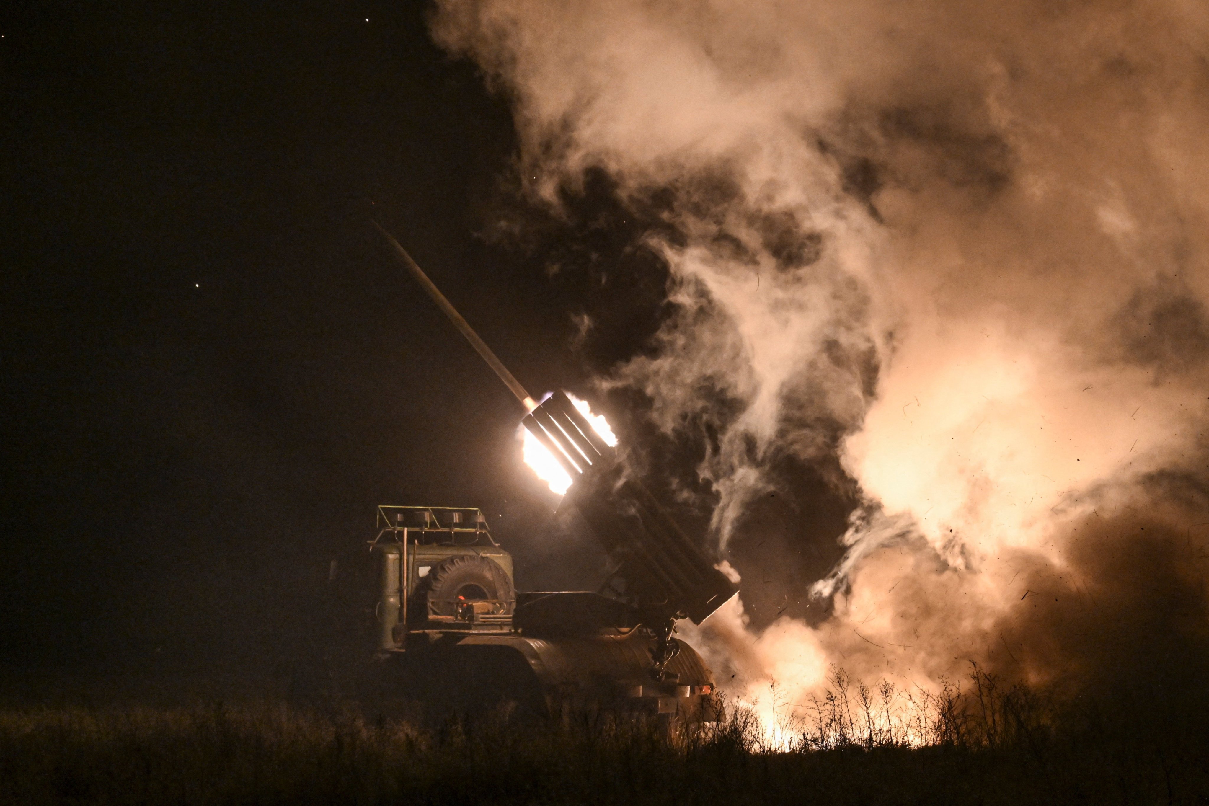 Ukrainian service members fire a BM-21 Grad multiple rocket launch system towards Russian troops in the Donetsk region on Thursday. Photo: Reuters
