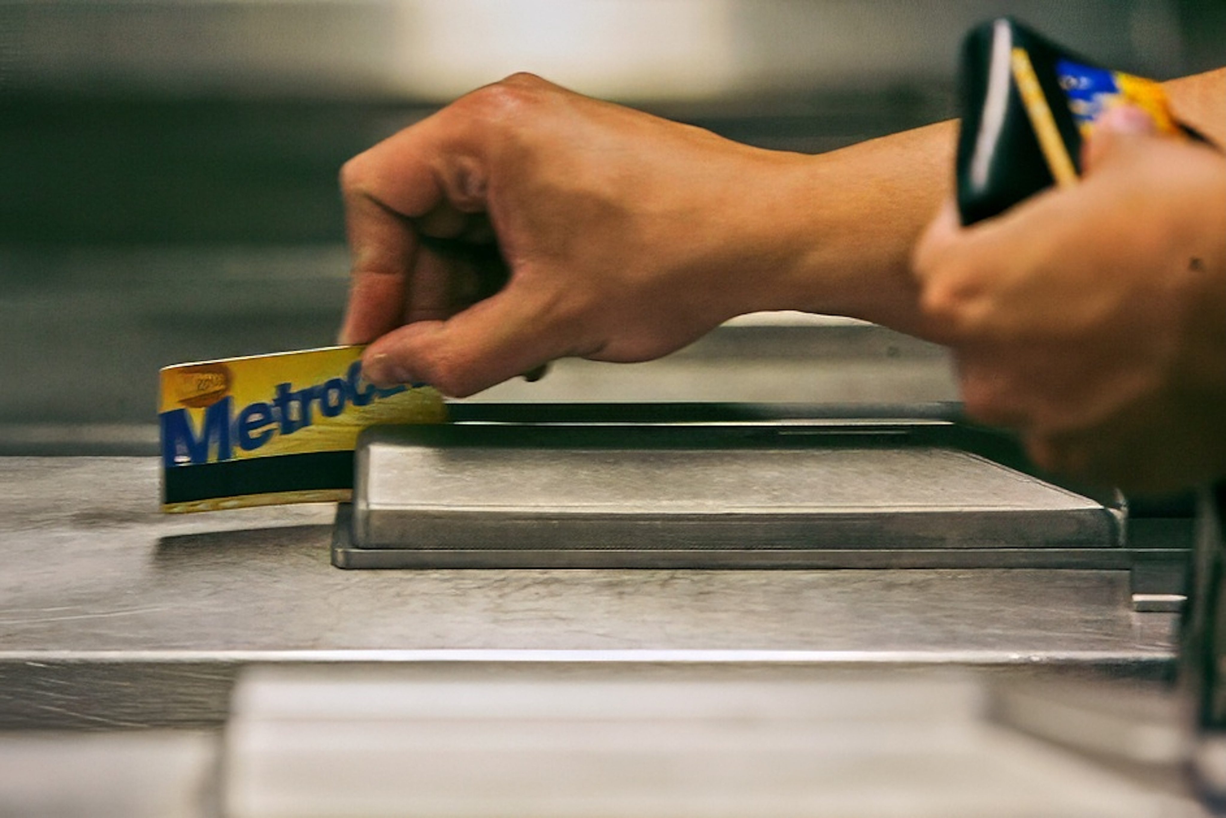 A New York subway rider swipes his MetroCard in a turnstile as he enters a subway station. Photo: AP