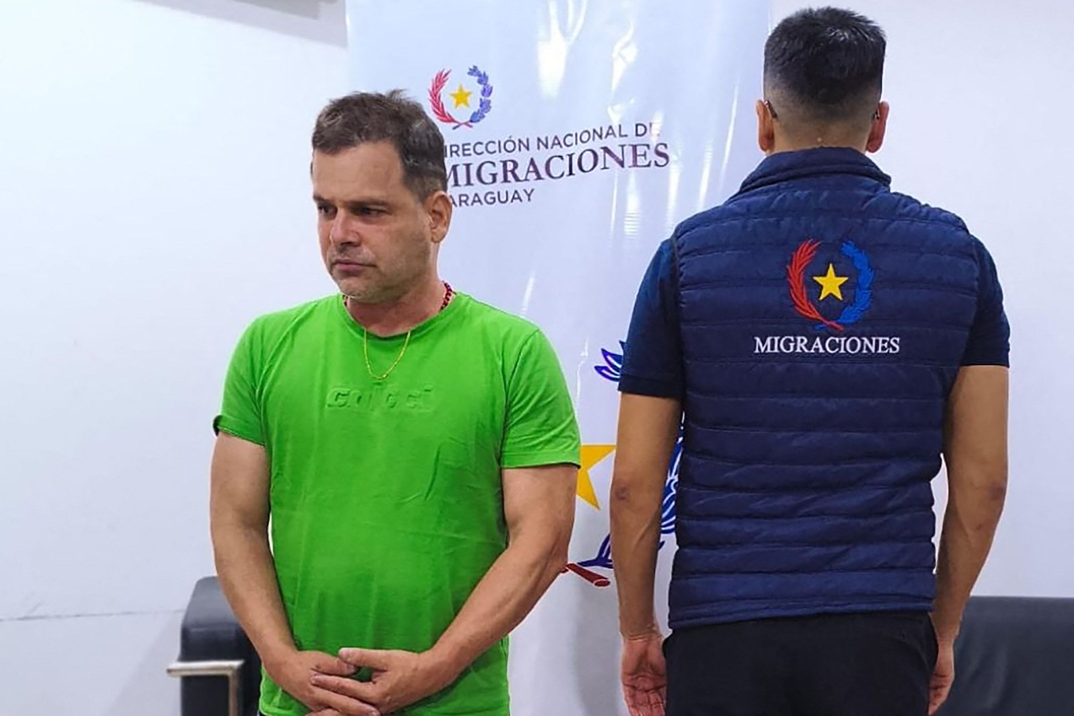 Silvinei Vasque, left, former director-general of the Brazilian Federal Highway Police, after his arrest at Silvio Pettirossi International Airport in Asuncion, Paraguay on Friday. Photo: Paraguay’s National Migration Directorate / AFP / Handout