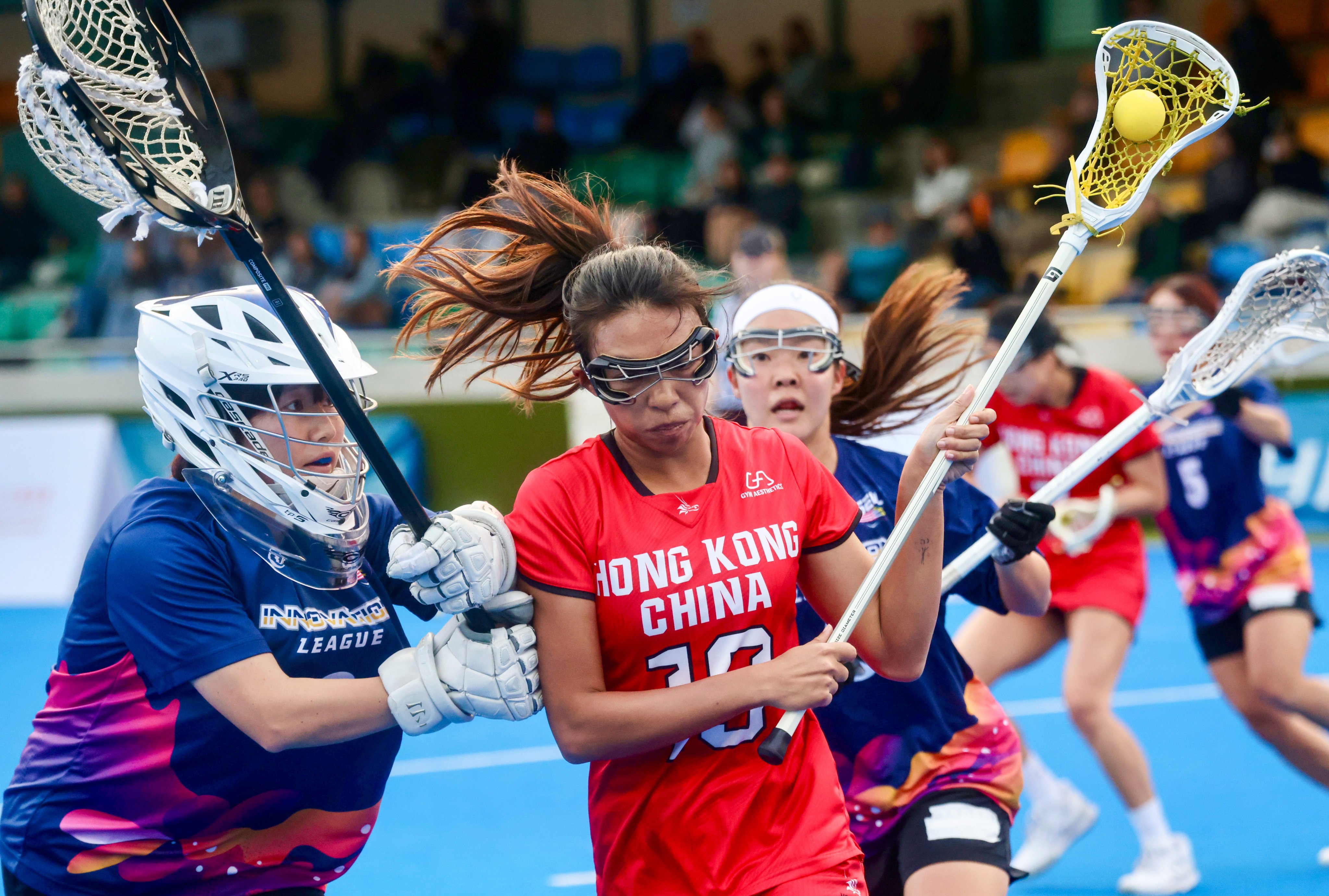 Hong Kong’s Steffi Sze (right) battles to keep possession during her side’s Hong Kong International Lacrosse Sixes semi-final against Second Era Leaders of Lacrosse. Photo: Jonathan Wong