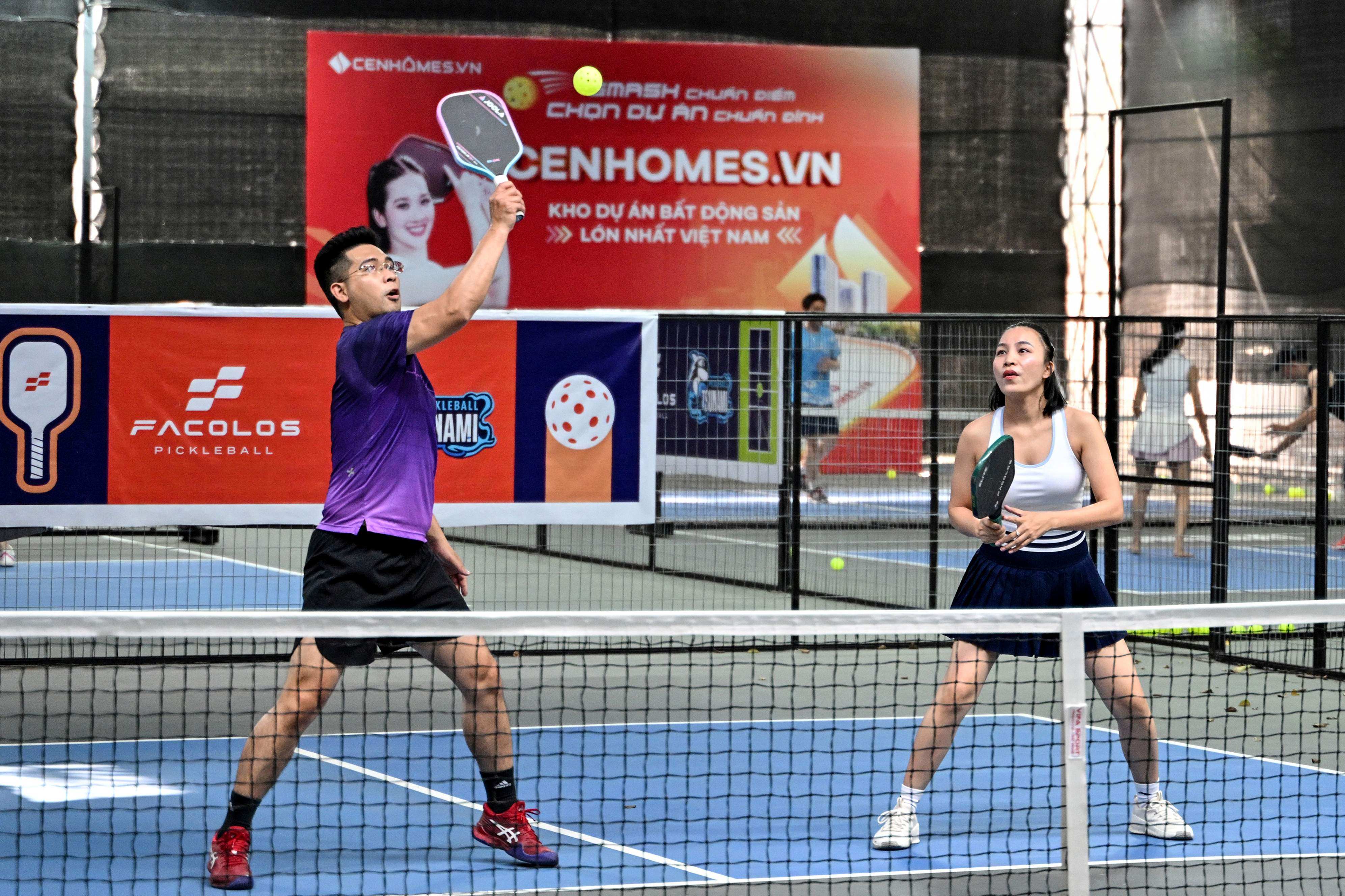 People play pickleball in the playground of a residential area in Hanoi, Vietnam. Photo: AFP