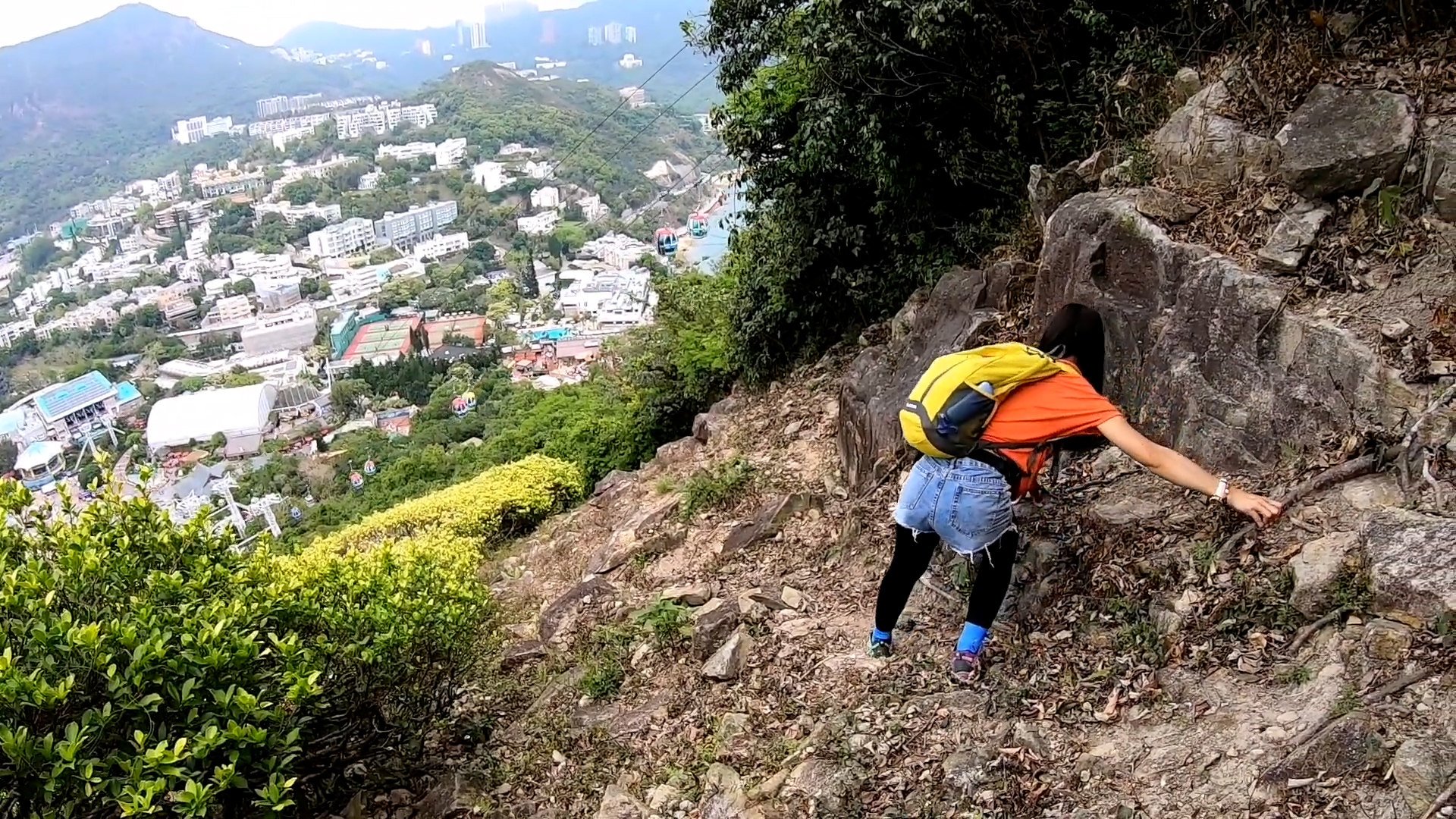 Hikers climbing down giant seahorse carved into Brick Hill.