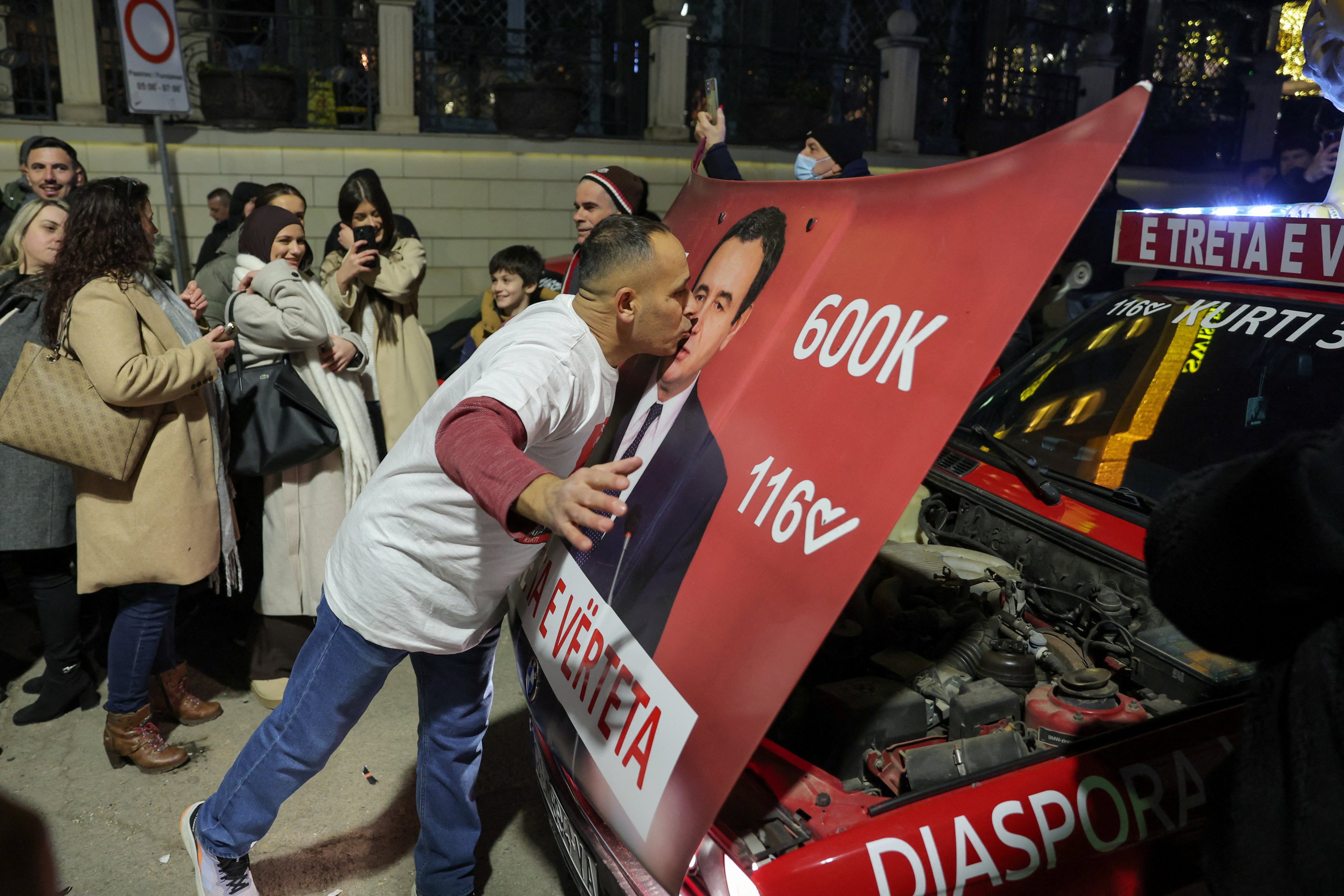 A voter kisses a poster with an image of Kosovo’s Prime Minister Albin Kurti on Sunday. Photo: Reuters