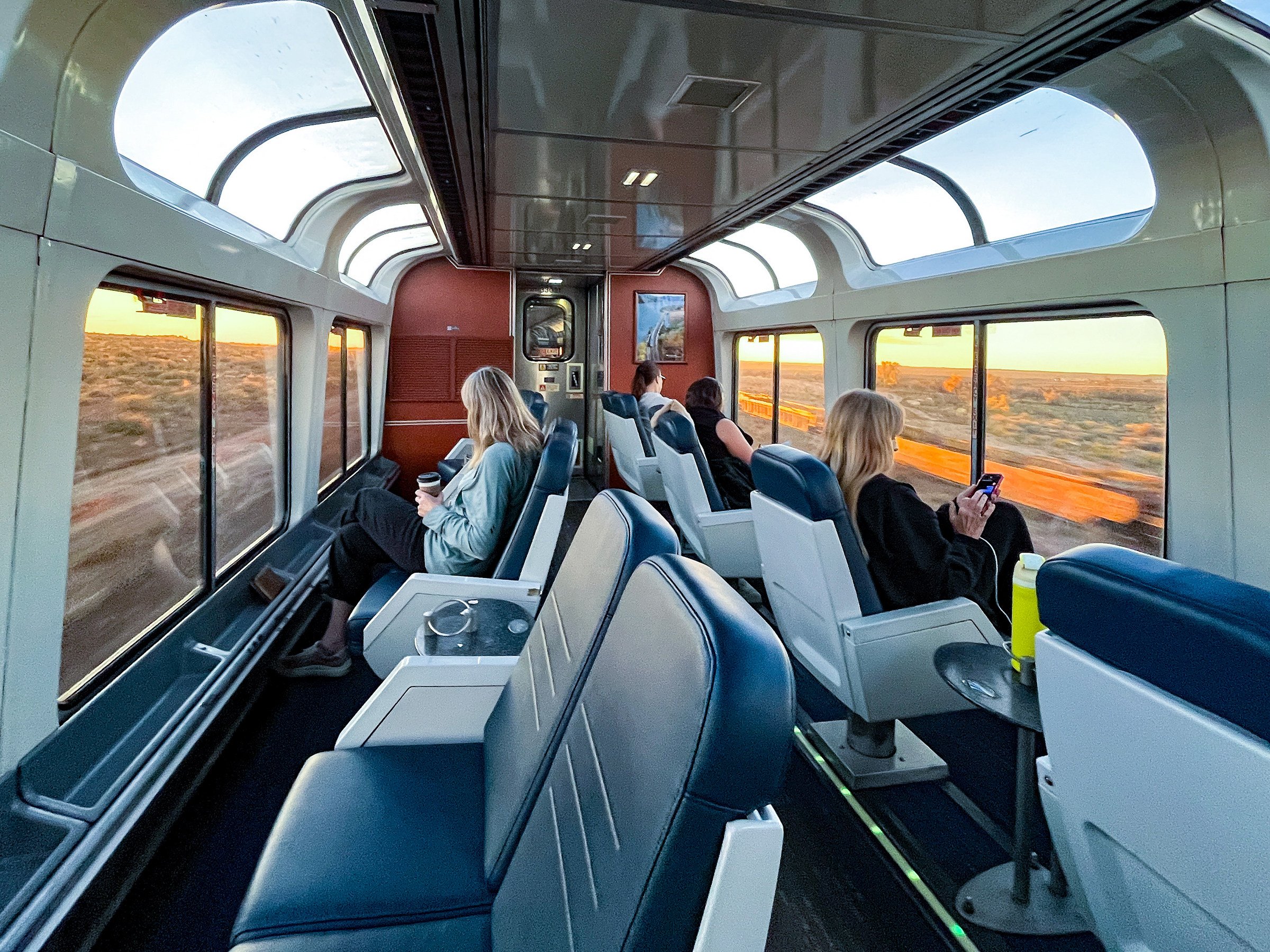 Passengers on the Southwest Chief train relax in the Sightseer Lounge on the trip between Los Angeles and Chicago. Photo: TNS