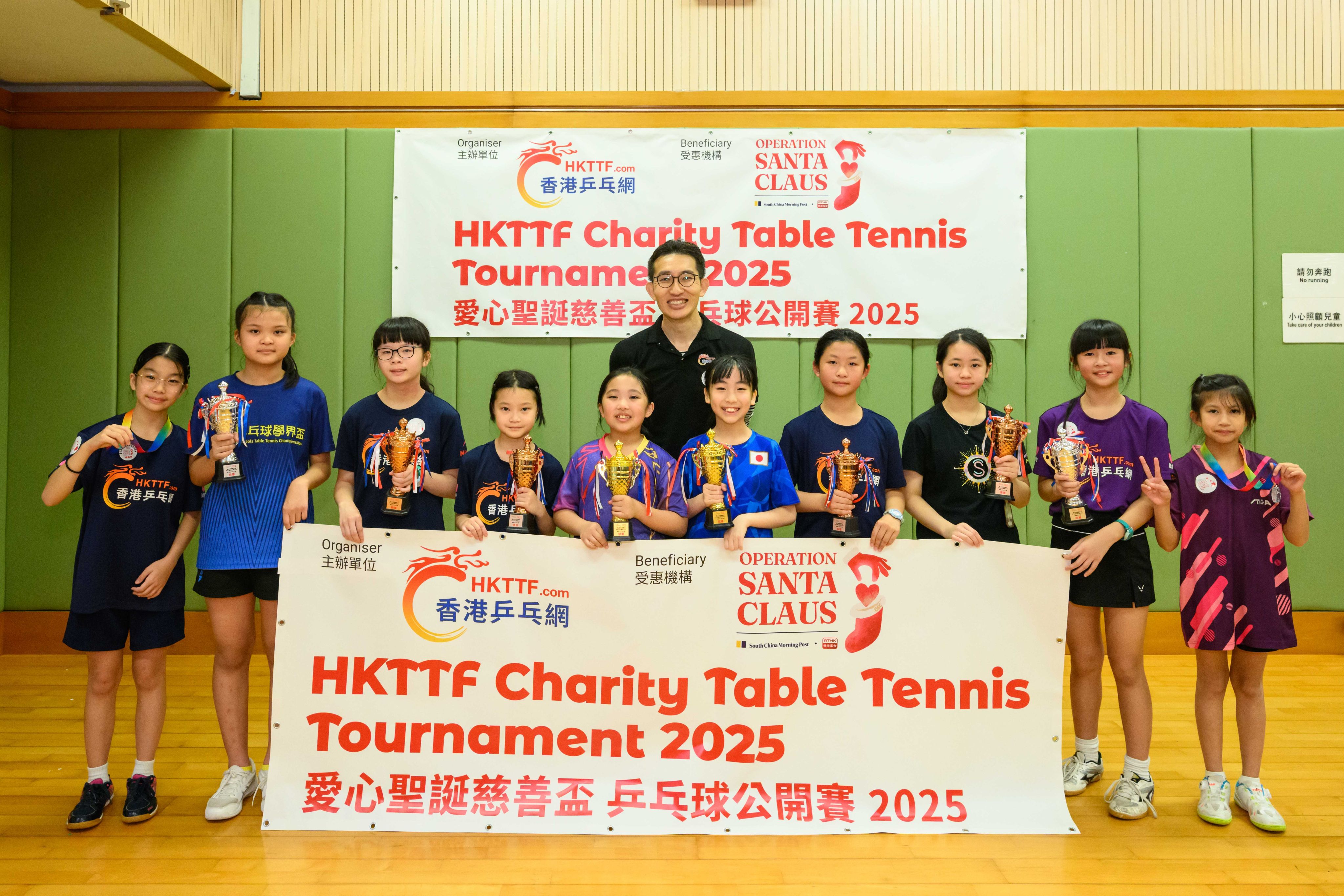 Winners of the Open U11 girls’ category receive their awards from HKTTF founder Ray Chan Shu-yan. Photo: Handout