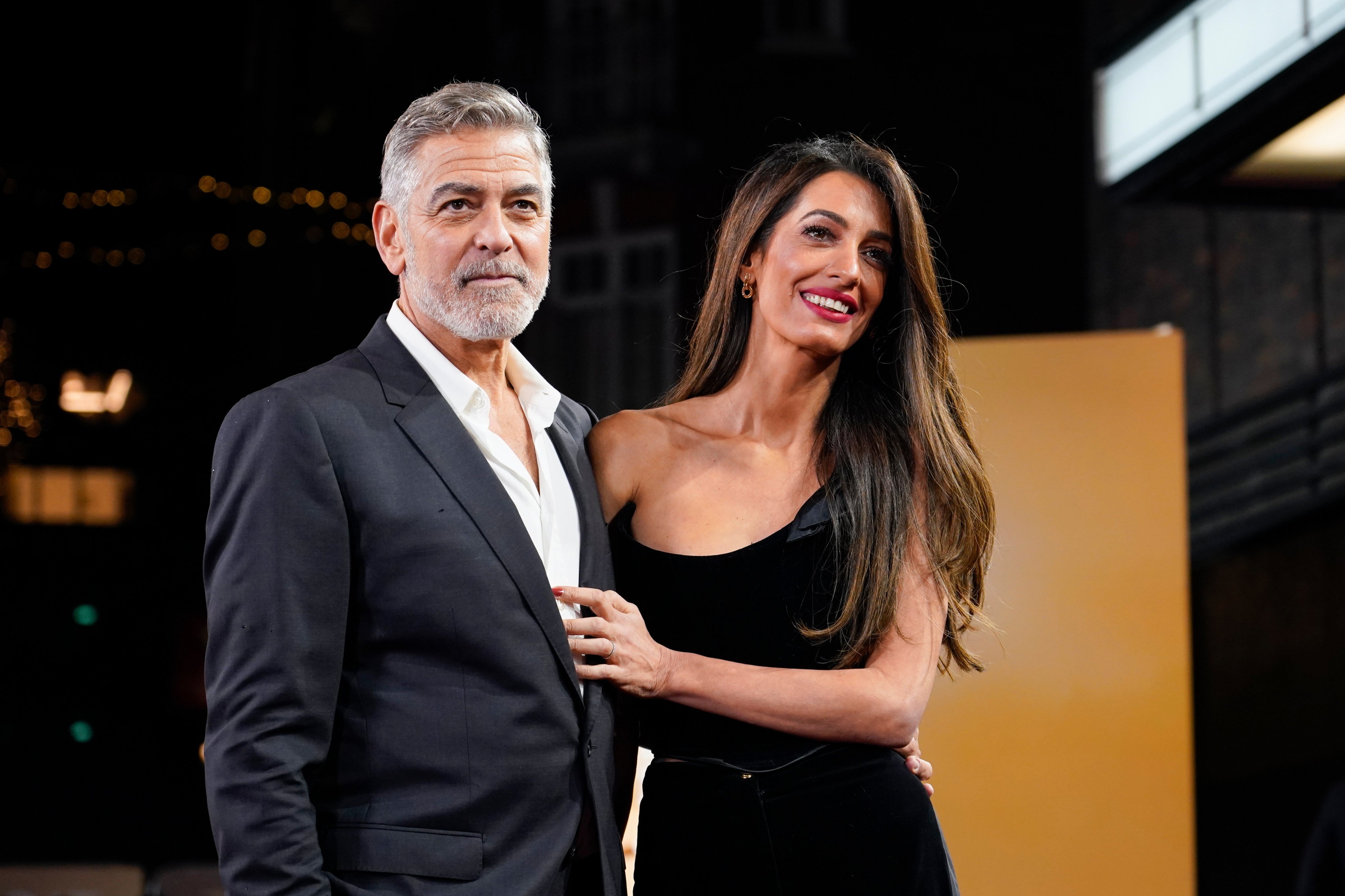 George Clooney and his wife Amal Clooney pose for photographers at the London screening of “The Boys In The Boat” in December 2023,. Photo: AP