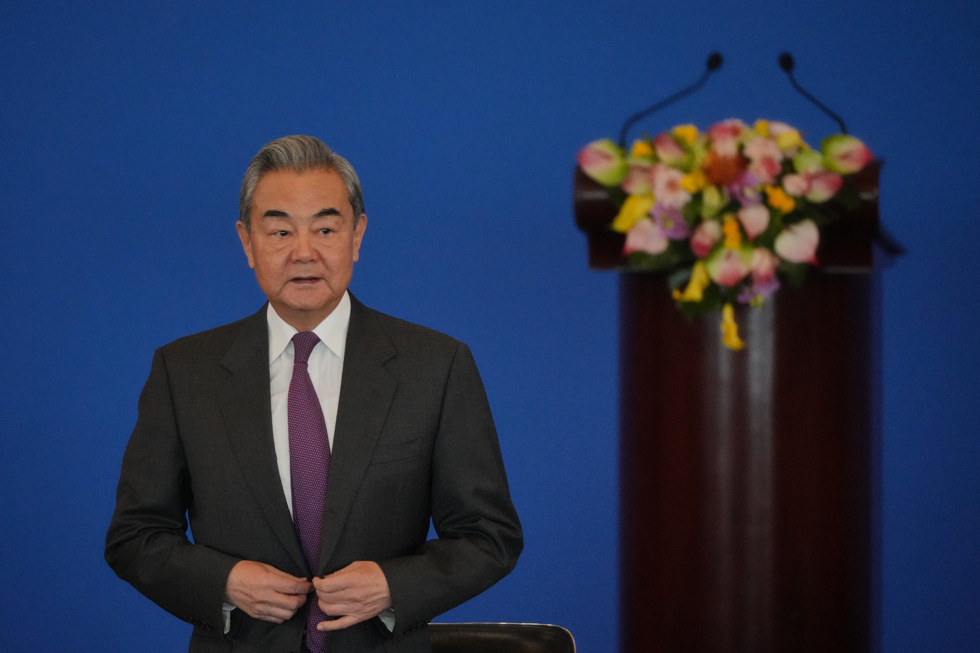 China’s Foreign Minister Wang Yi arrives to deliver an opening speech at the annual Symposium on the International Situation and China’s Foreign Relations in Beijing on December 30, 2025 Photo: AP