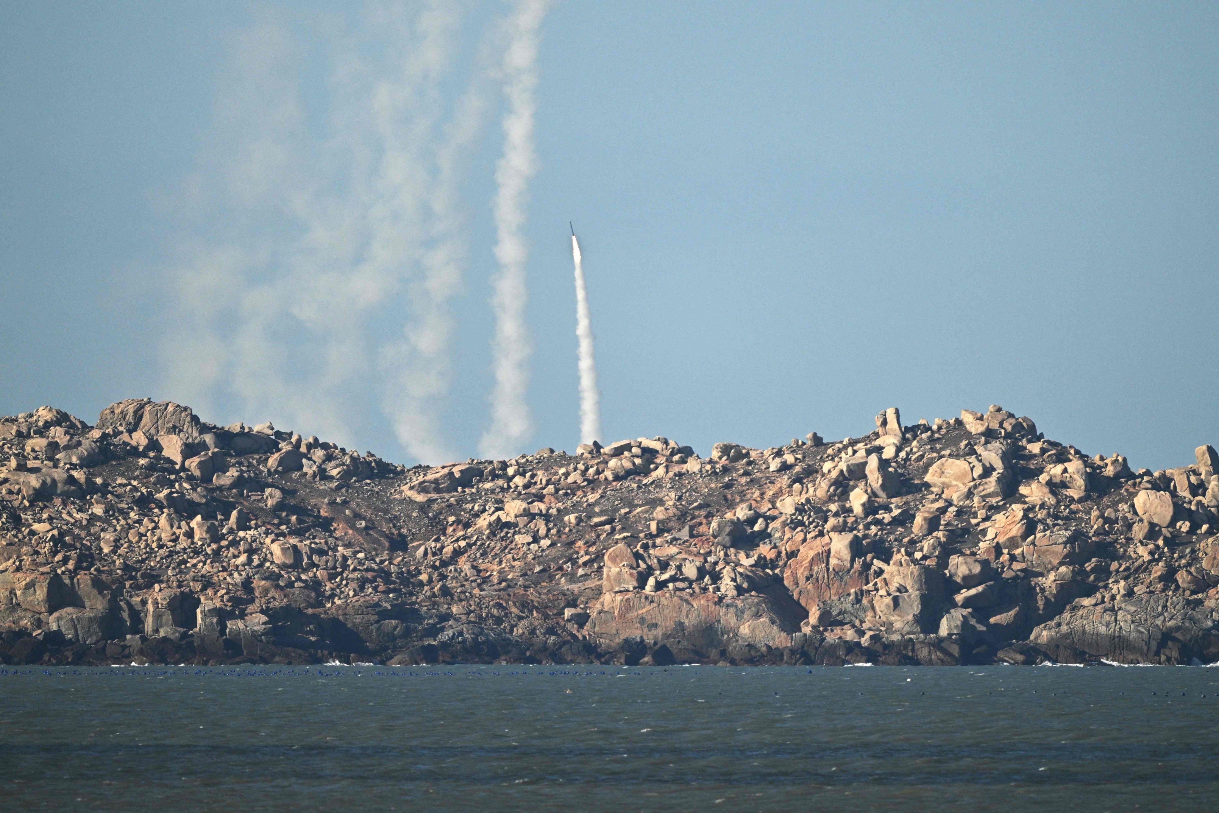 PLA soldiers fire a rocket into the air during drills on Pingtan Island in Fujian province, the closest mainland Chinese point to Taiwan, on Tuesday. Photo: AFP