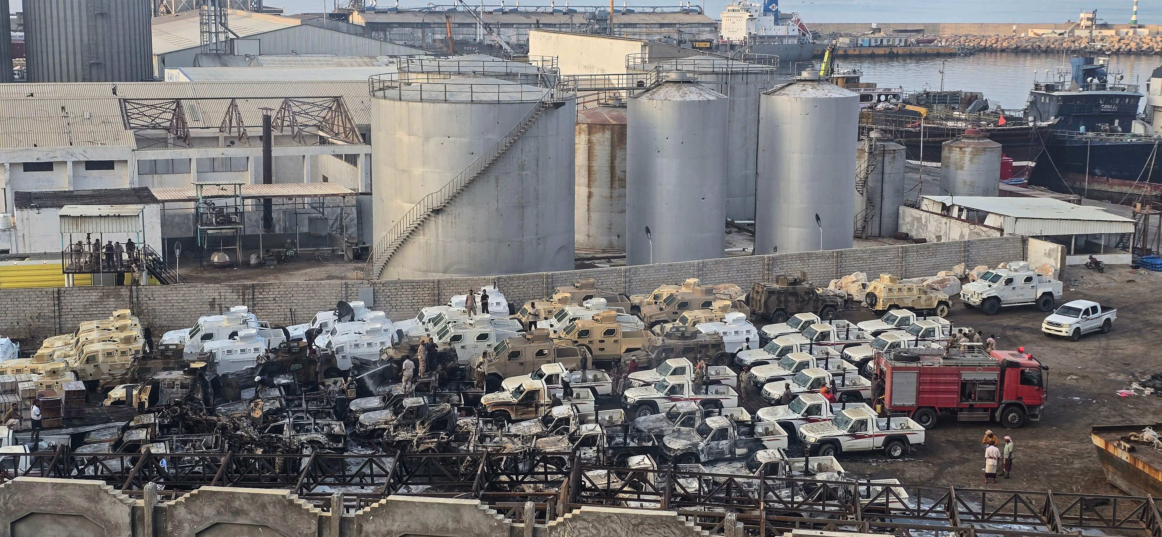 Damaged military vehicles, reportedly sent by the United Arab Emirates to support Southern Transitional Council separatist forces, following an air strike carried out by the Saudi-led coalition in the port of Mukalla, southern Yemen. Photo: AFP