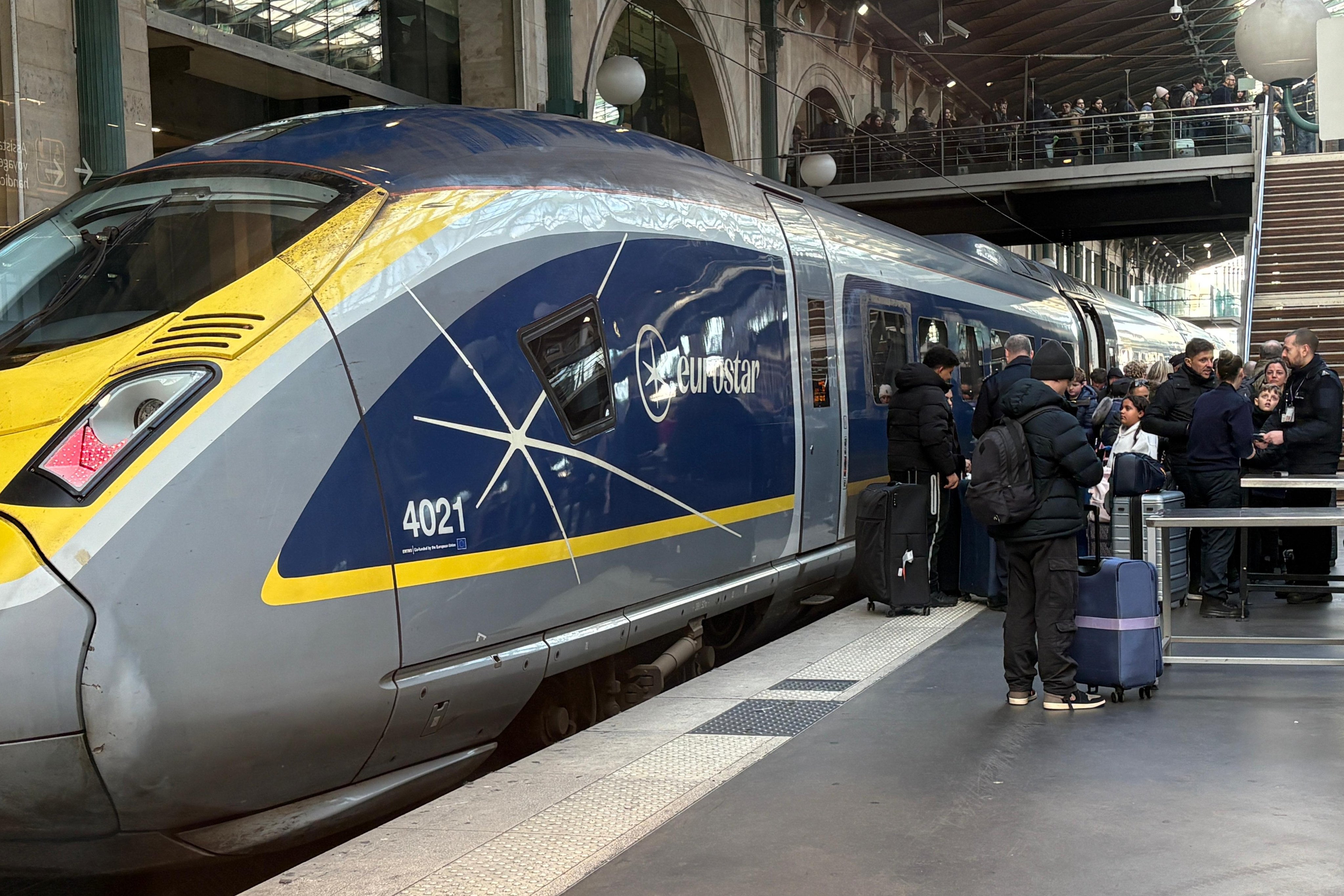 Travelers disembark a Eurostar train at Gare du Nord after a power supply incident in part of the Channel Tunnel disrupted train and shuttle traffic on Tuesday in Paris. Photo: AP