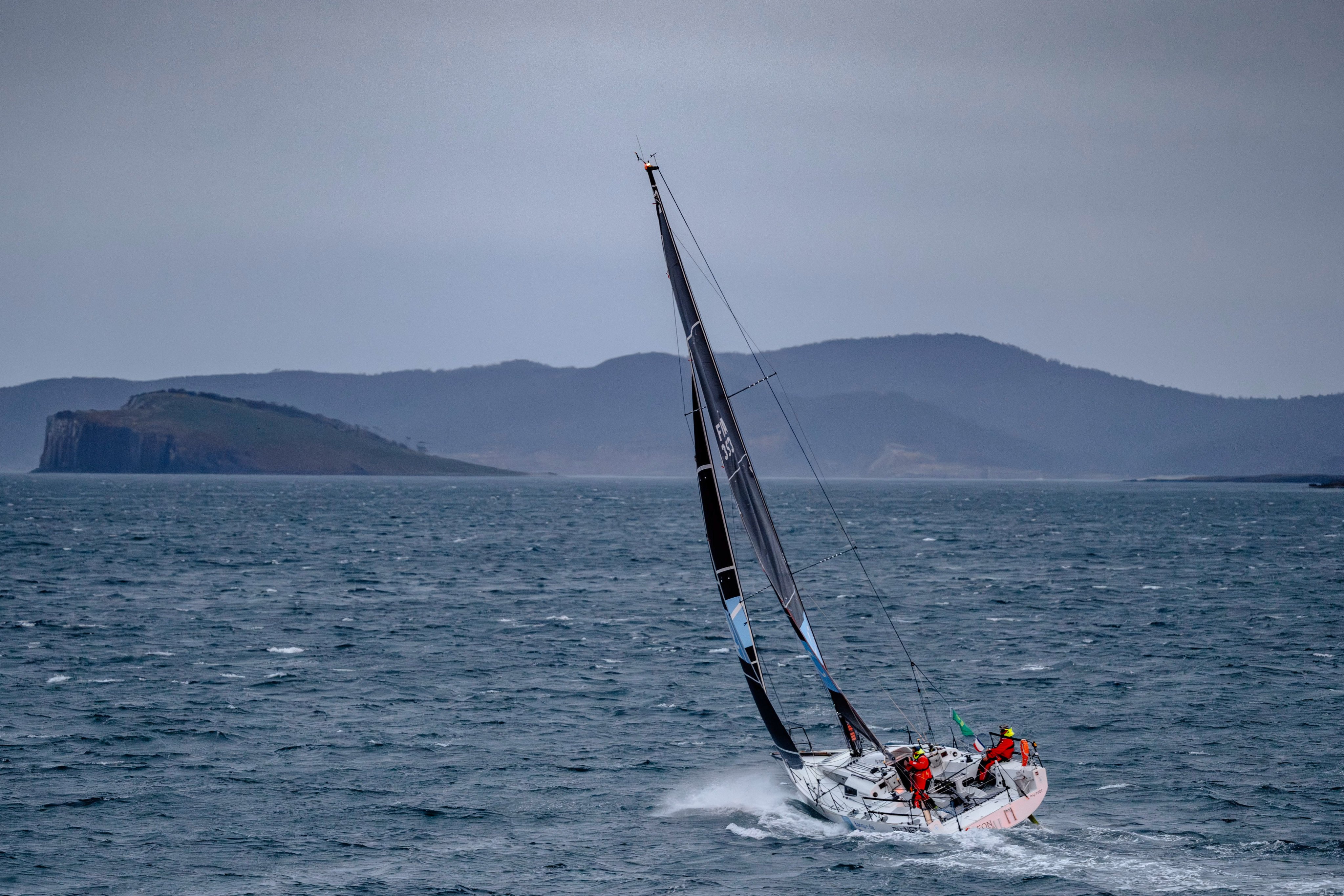 Michel Quintin and Yann Rigal sail BNC as they close in on the finish of the Sydney to Hobart race. Photo: AP