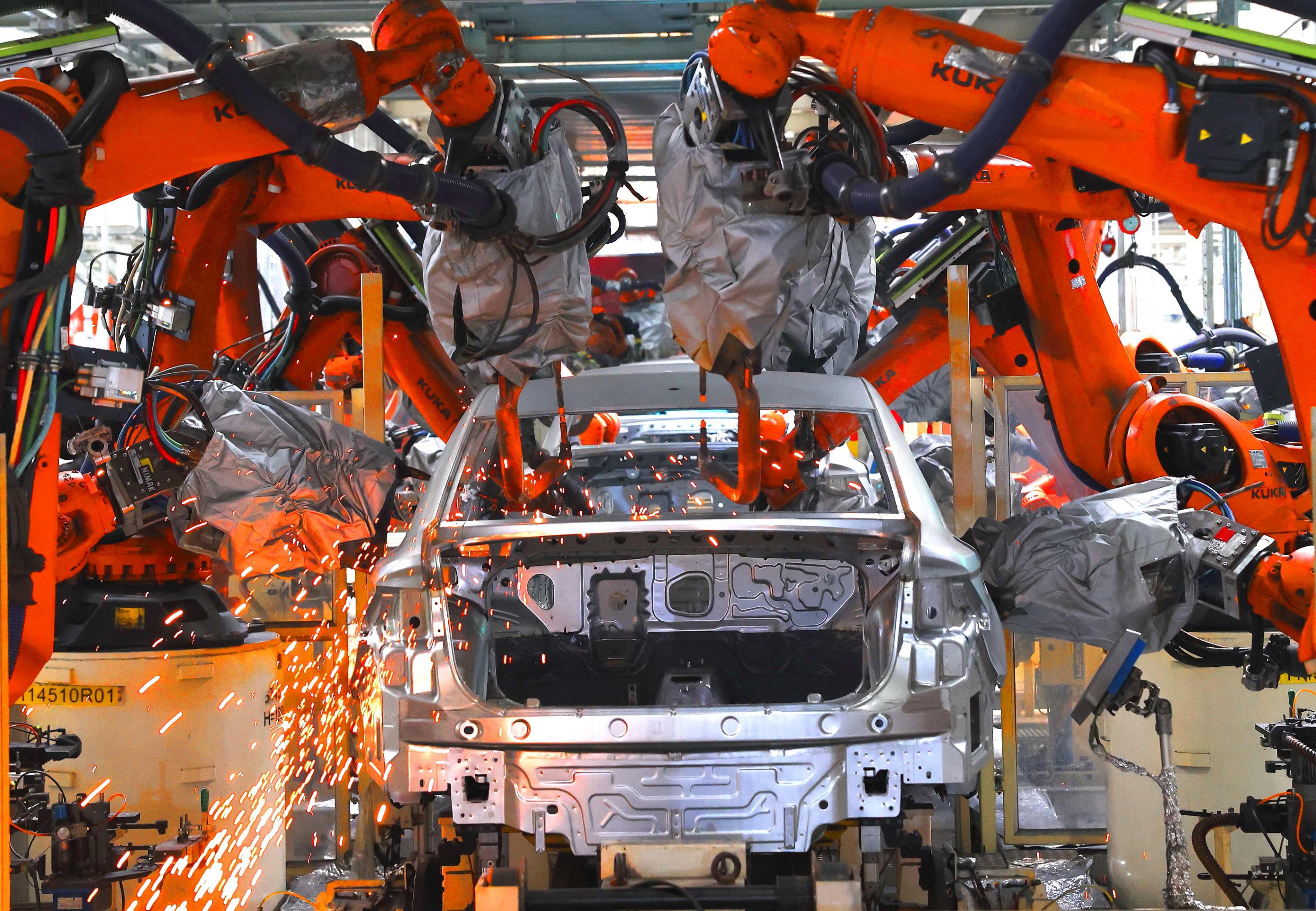 Robots carry out welding operations at the FAW-Volkswagen production based in Jimo district, Qingdao, eastern China’s Shandong province, on February 19. Photo: AFP