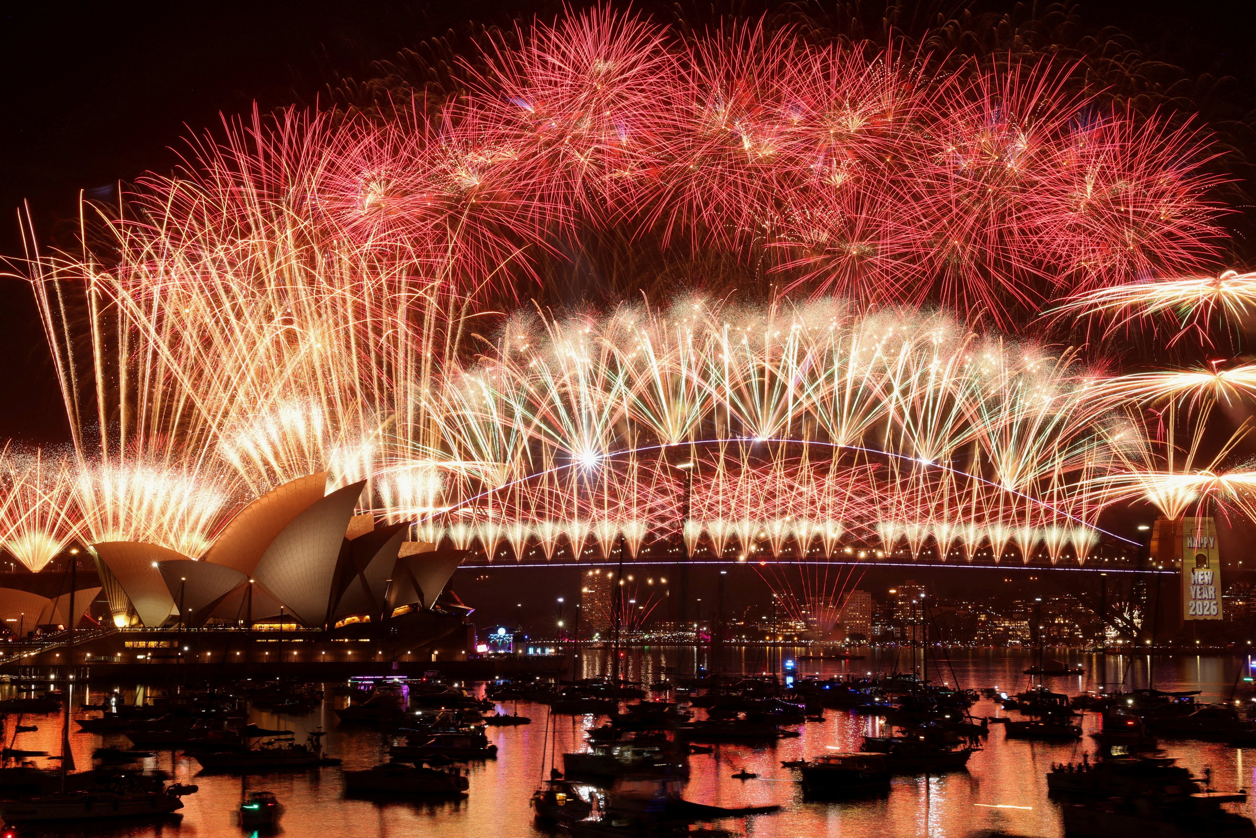 Fireworks explode over Sydney Harbour Bridge to mark the New Year. Photo: Reuters
