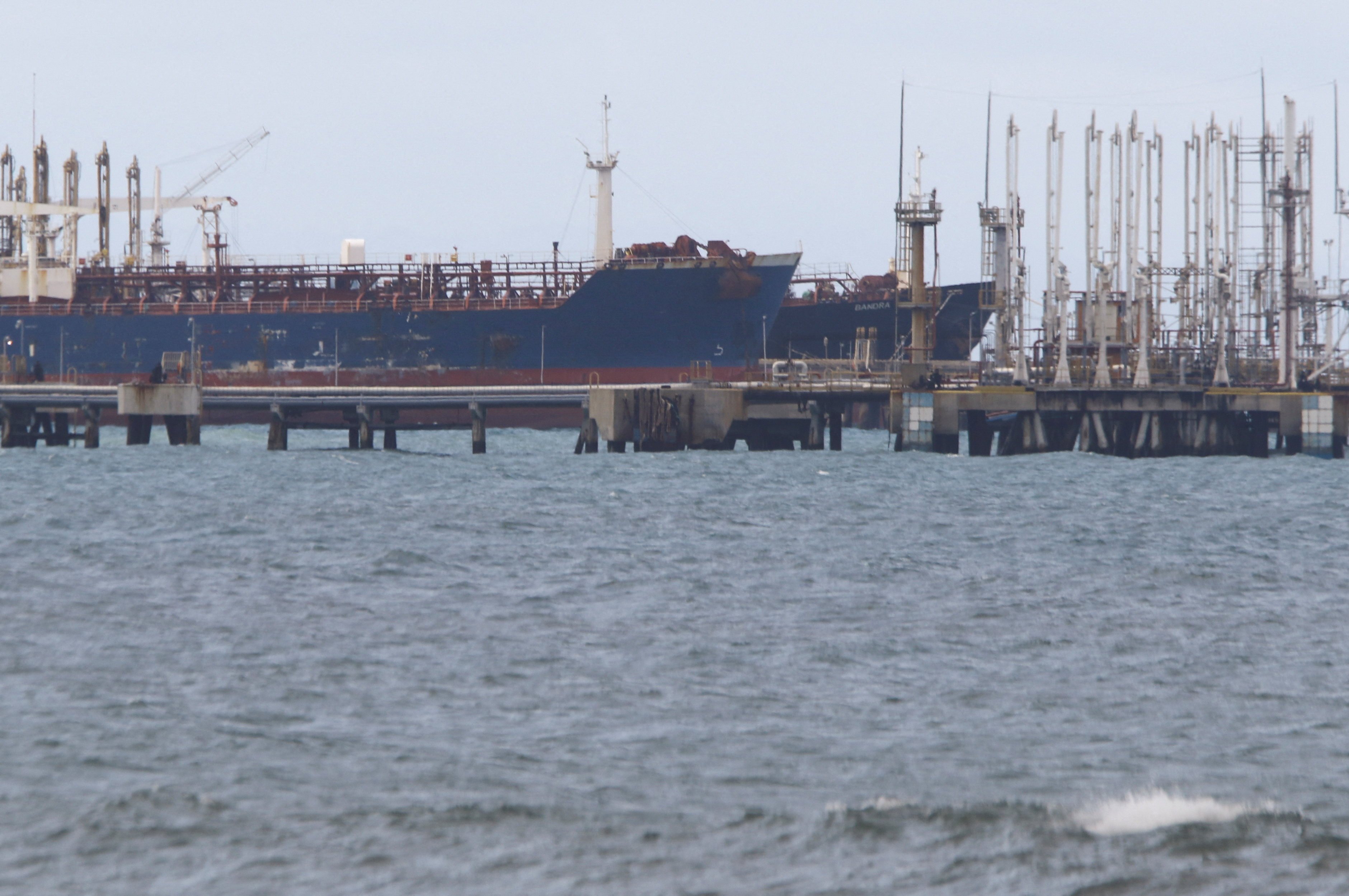 The Guinea-flagged oil tanker MT Bandra, which is under sanctions, is partially seen alongside another vessel at El Palito terminal, near Puerto Cabello, Venezuela on Monday. Photo: Reuters