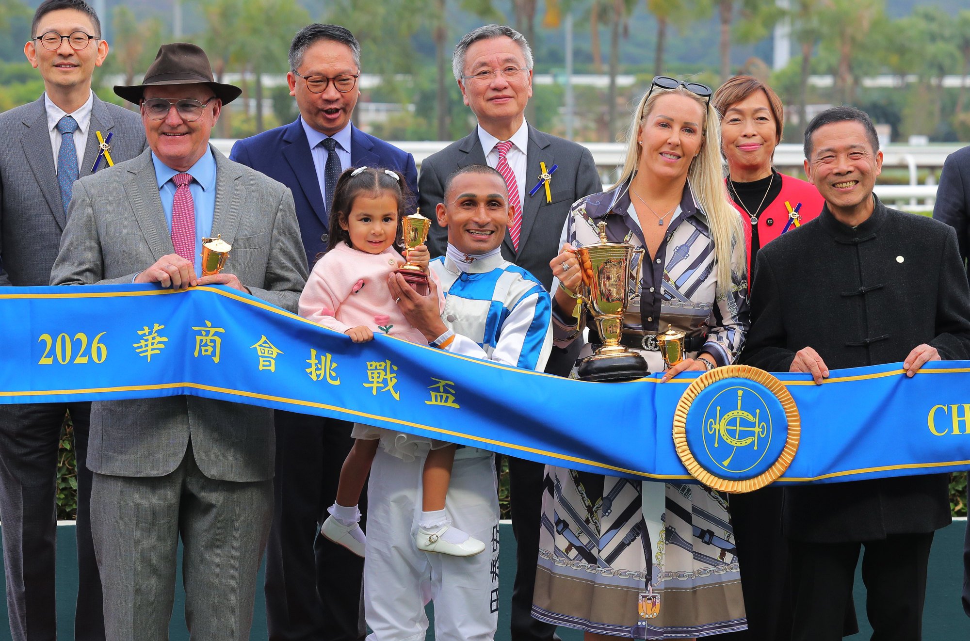 Trainer David Hayes (front left), jockey Karis Teetan and connections of Storm Rider celebrate.