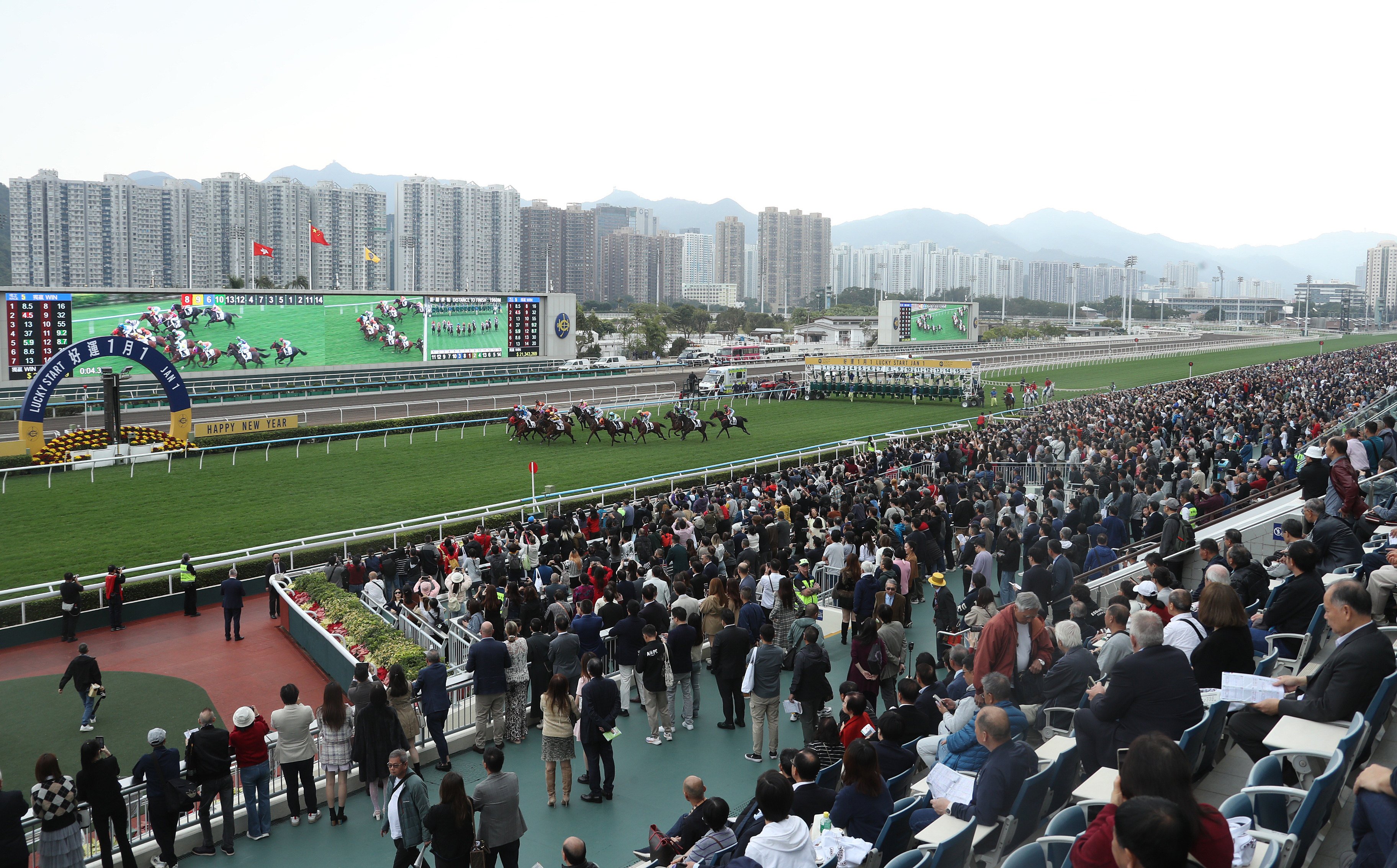 Spectators watch as Yiu Cheung Victory, ridden by Alexis Badel wins the fifth race at Sha Tin. Photo: Kenneth Chan.