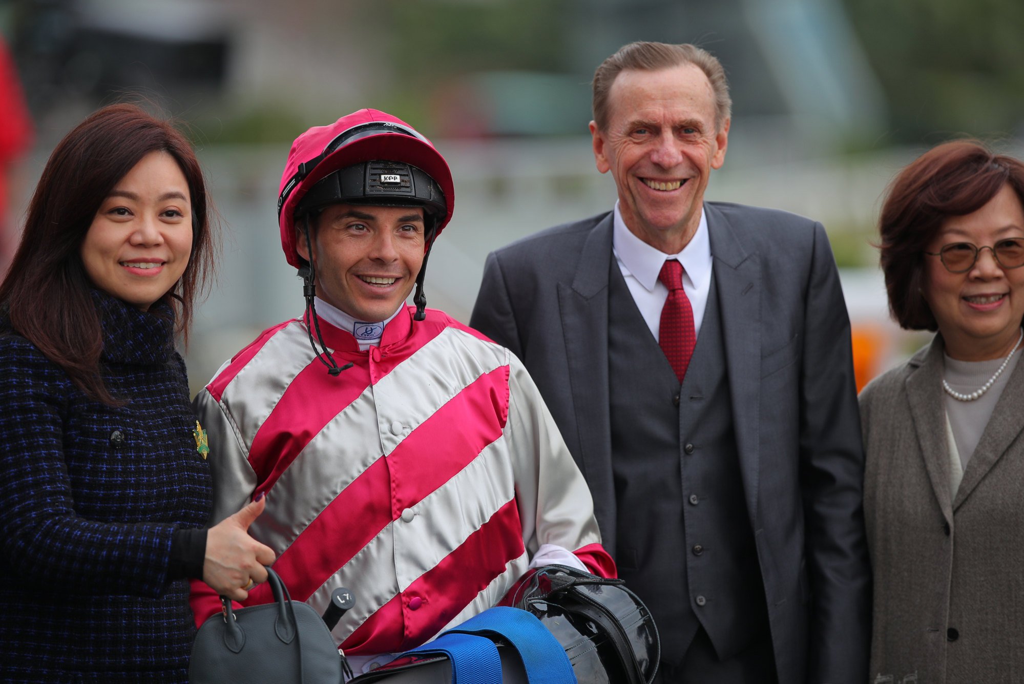 Jockey Maxime Guyon and John Size celebrate with connections of Endued.